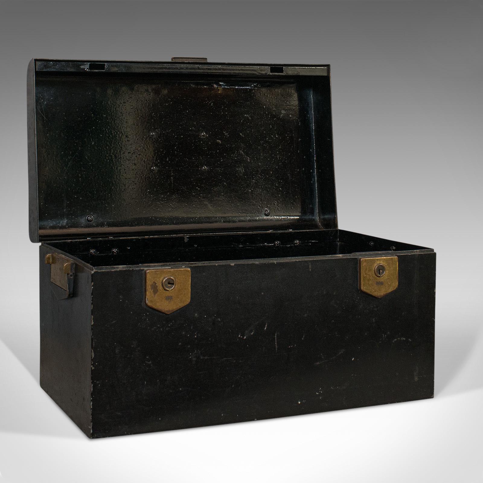 This is a vintage deed box. An English, Art Deco iron document or deposit chest, dating to the early 20th century, circa 1930.

Displays a desirable aged patina
Painted black finish over iron shows weathering commensurate with age
Bronze