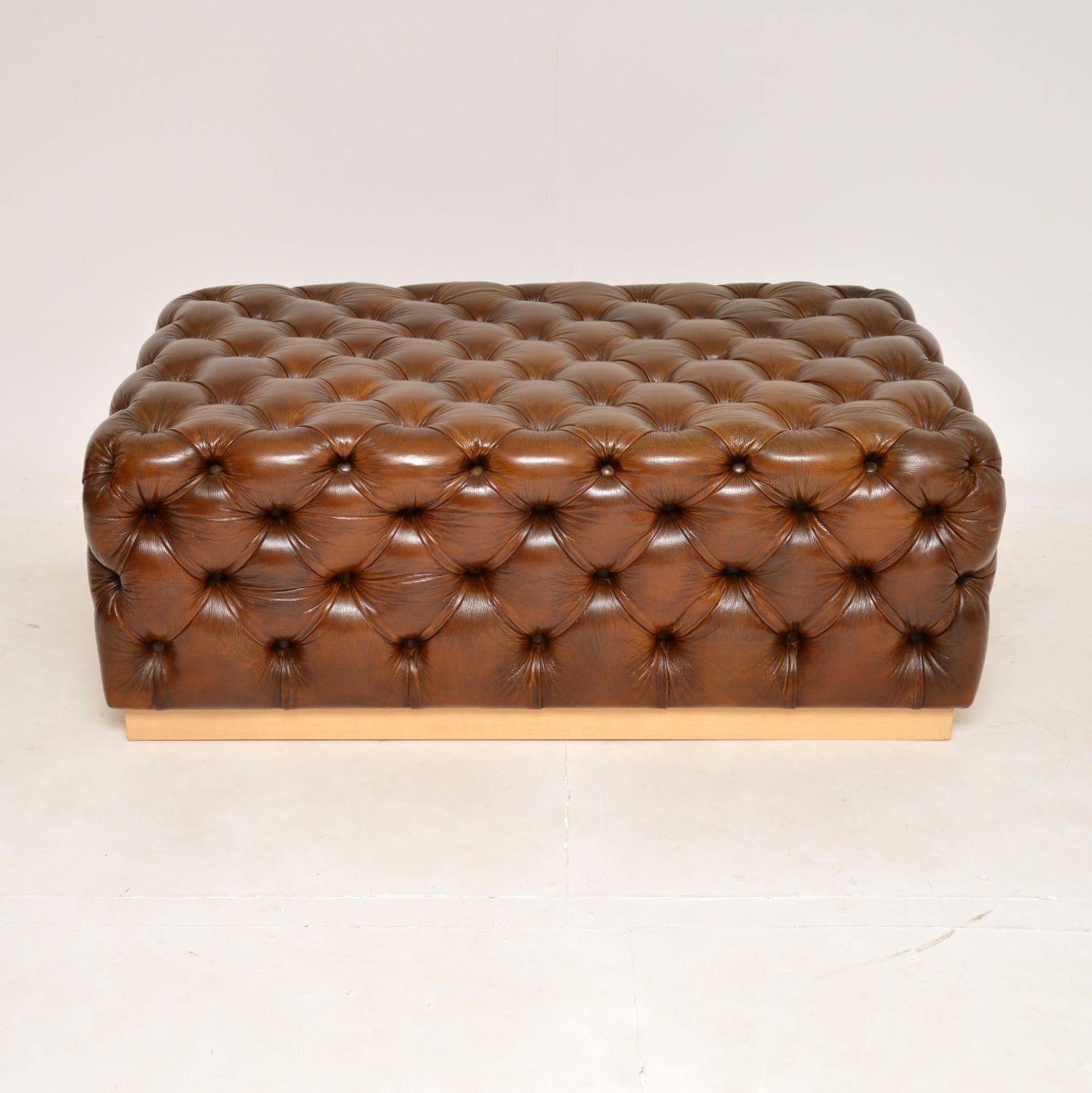 A stylish and very useful deep buttoned leather ottoman stool. This is not antique, it probably dates from the late 20th century, but it has been hand coloured by our leather restorer to give it beautiful and unique look.

It is a great size and is