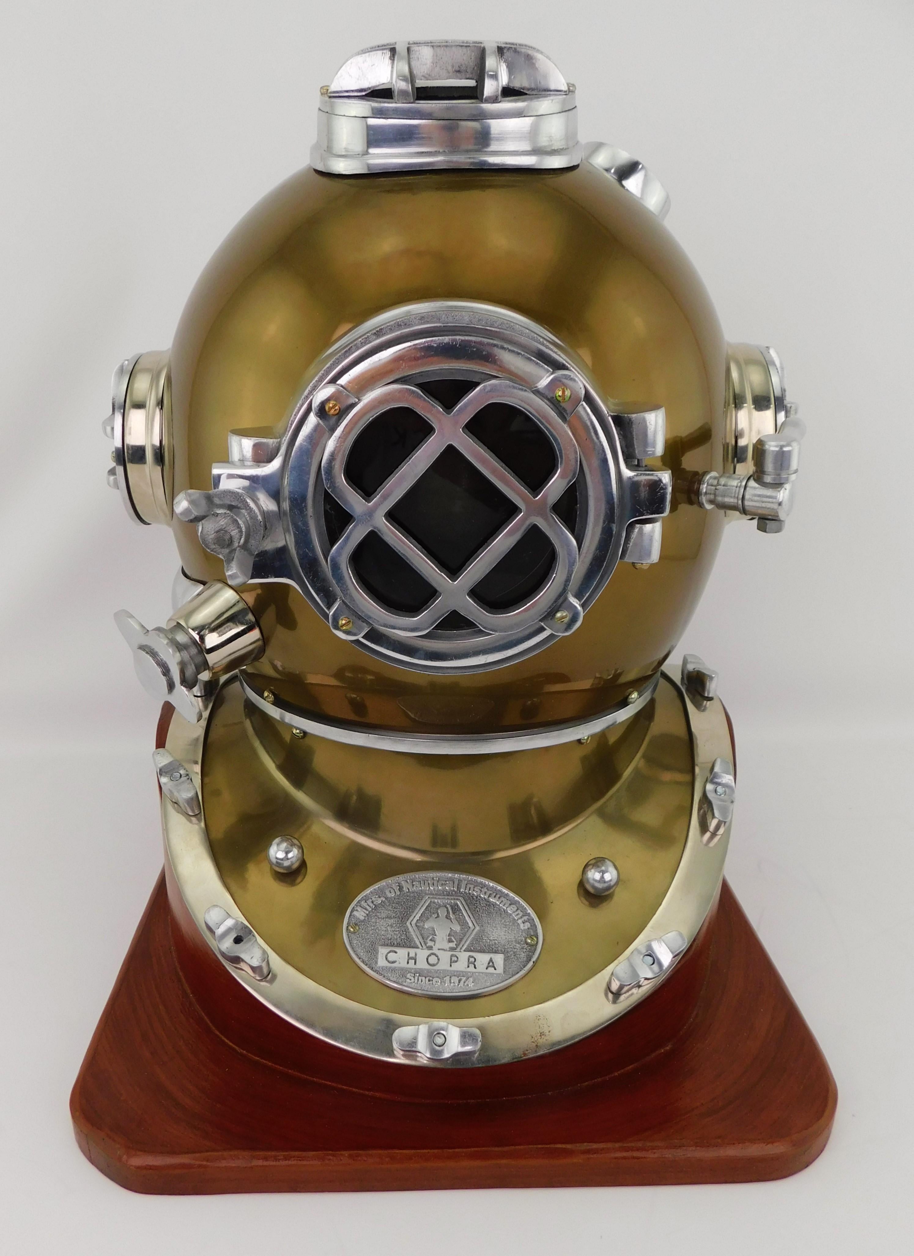 Mid 1970's copper and steel CHOPRA (Manufacturers of Nautical Instruments Since 1974) diving helmet mounted on a wood base. The helmet is based on a vintage antique 1800's design and can be completely unscrewed from the wood base. Makes a great