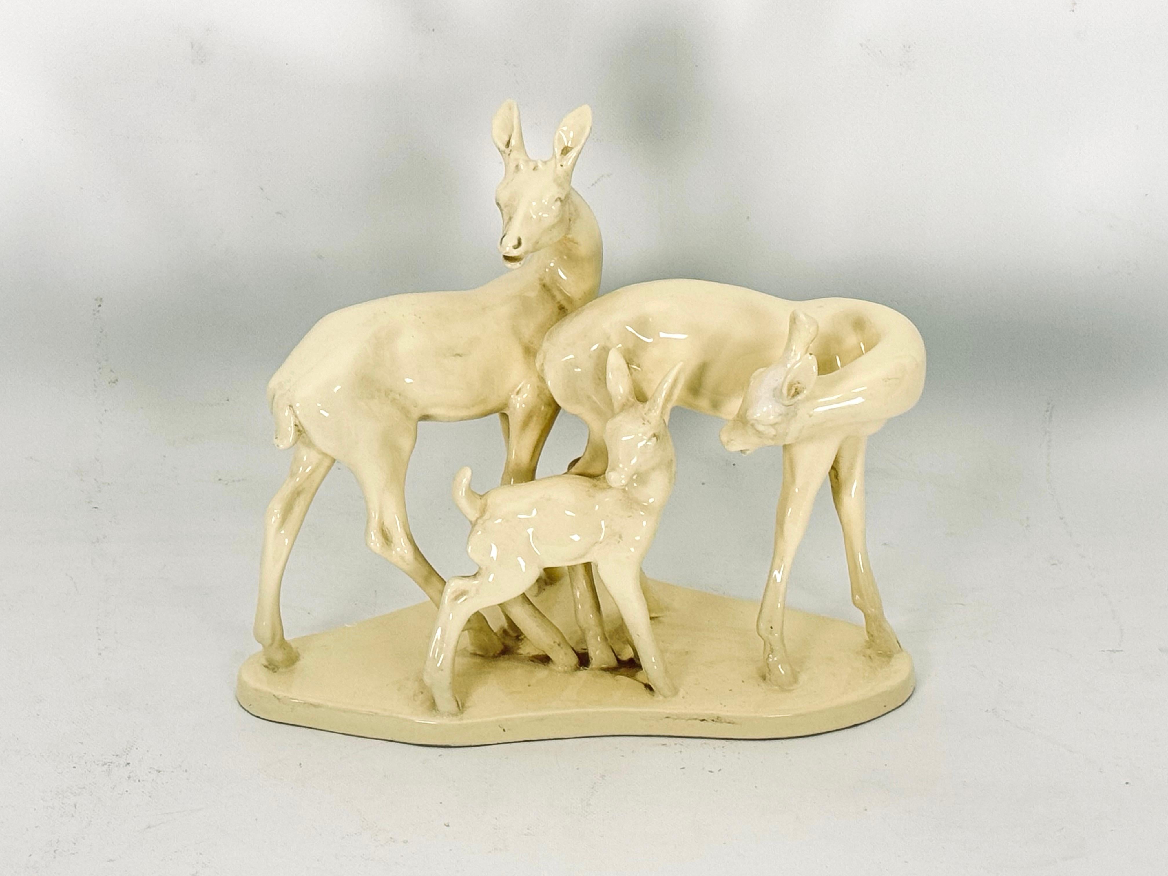 Ceramic sculpture representing a family of young deer in good vintage condition with trace of age and use. Produced in Italy during the 50s

