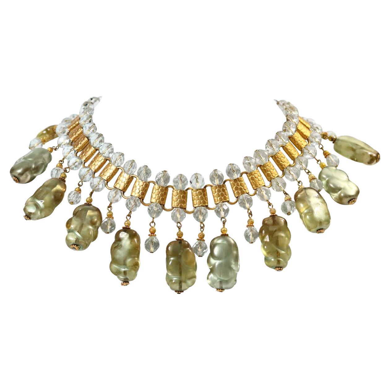 Vintage deLillo Gold Tone with Light Green Dangling Beads Necklace Circa 1970s.  This is so special.  The larger beads are a mottled light green citrine with a gold piece at the bottom to finish.  There is a lighter bead between each large bead to