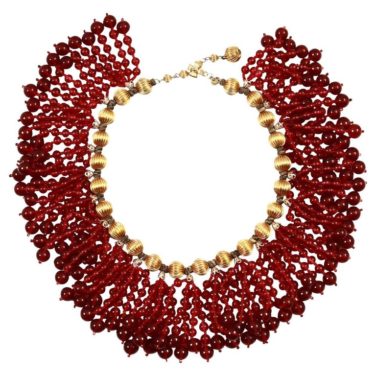 Vintage deLillo Gold Tone with Red Dangling Beads Circa 1970's. This gorgeous necklace has additional chain in tHE back so will allow you to have it sit closer to the neck or longer to allow for a choker look or a necklace look. This is one of his