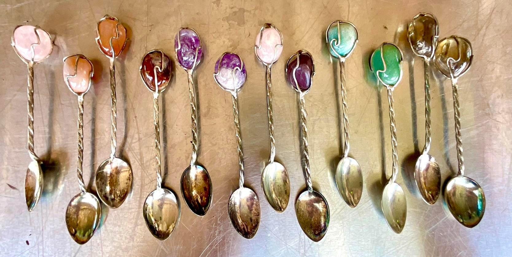 A gorgeous set of 12 vintage demitasse spoons with silver wrapped handles. Acquired at a Palm Beach estate