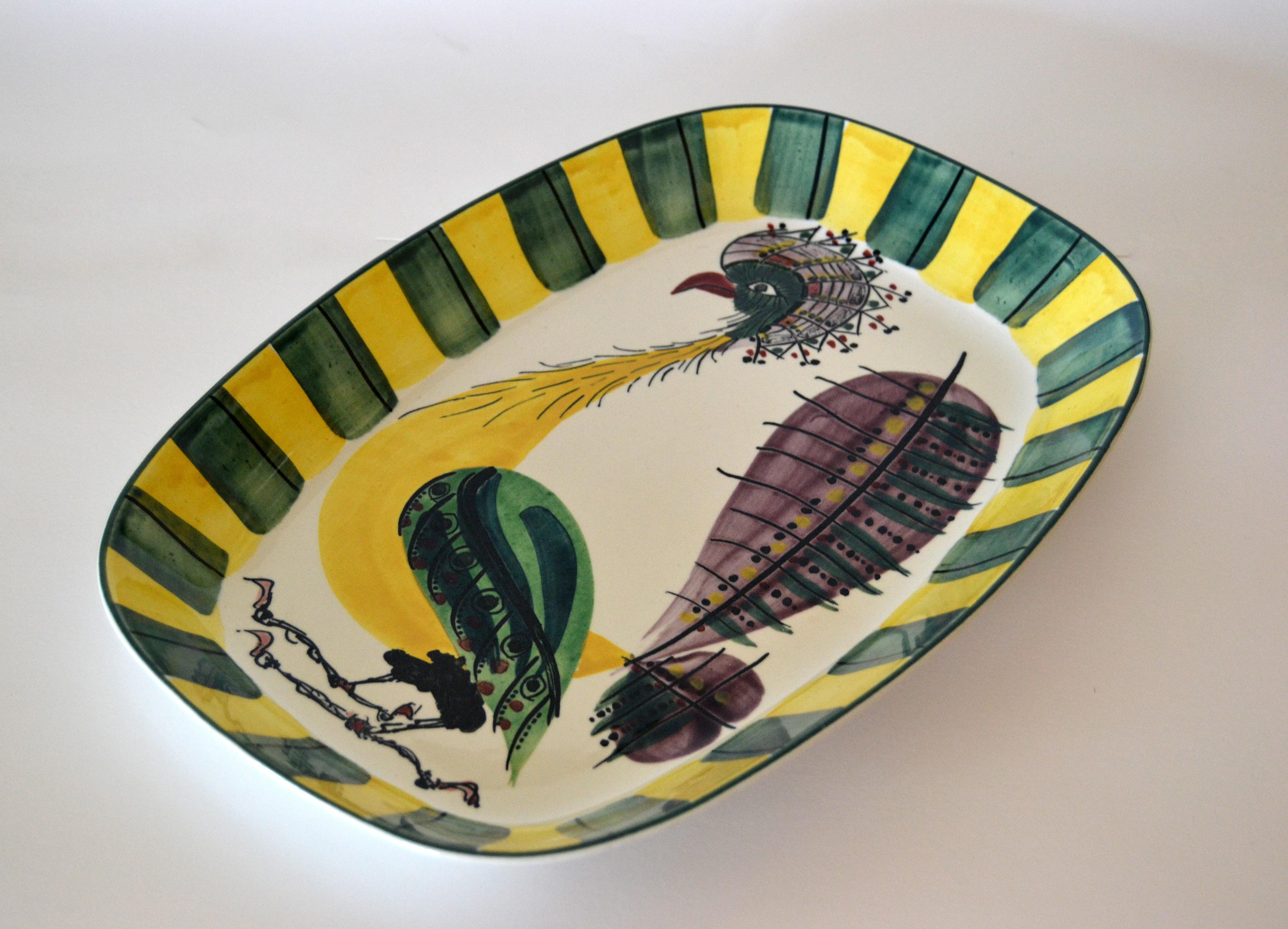 Scandinavian Modern glazed Denmark Royal Copenhagen Fajance Peacock Bird Pottery, Ceramic Serving Platter.
Marked on the underside, numbered and signed BA.