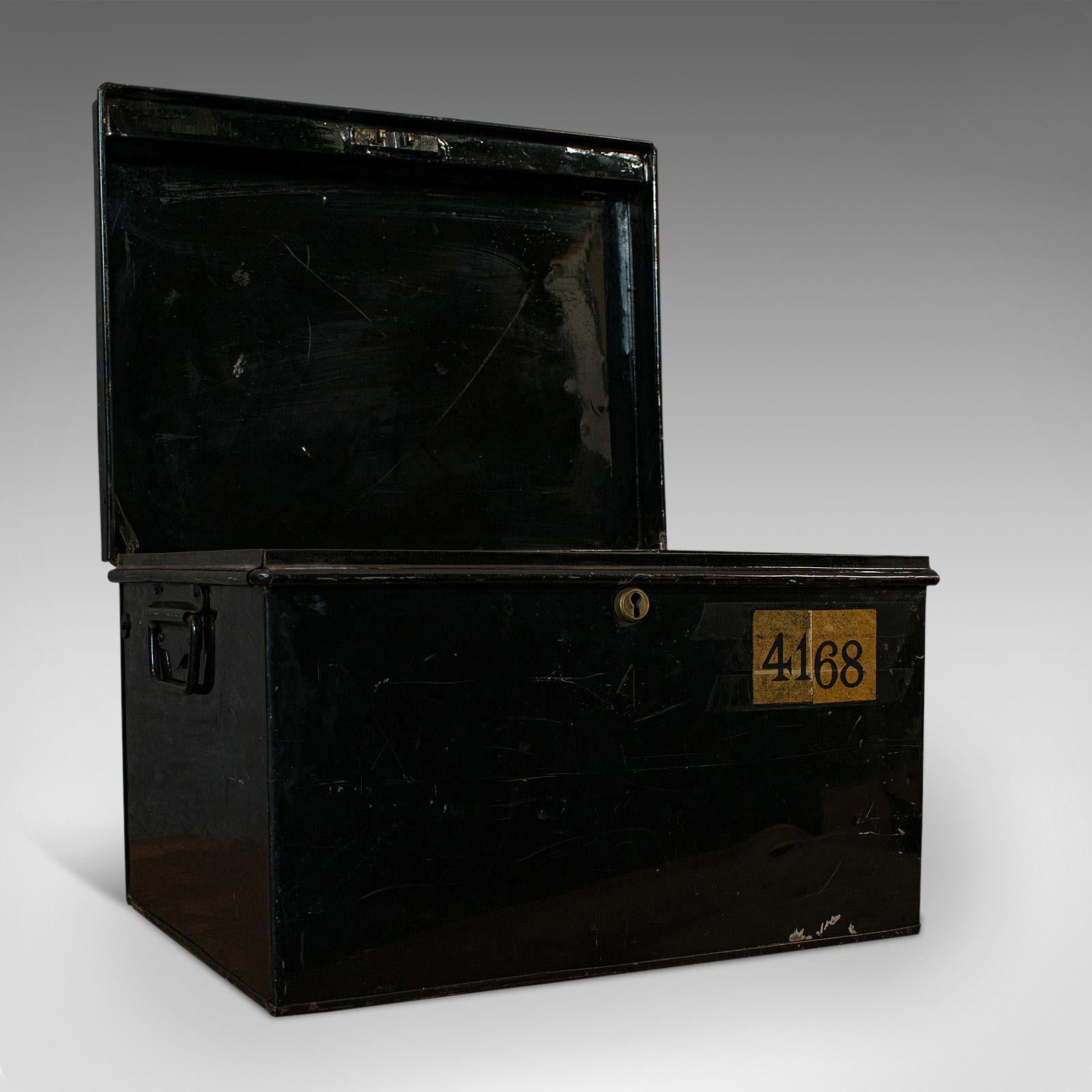 This is a vintage deposit box. An English, metal document chest, dating to the mid-20th century, circa 1940.

Charming vintage storage
Displaying a desirable aged patina
Black painted metal shows wear commensurate with age

Small, working
