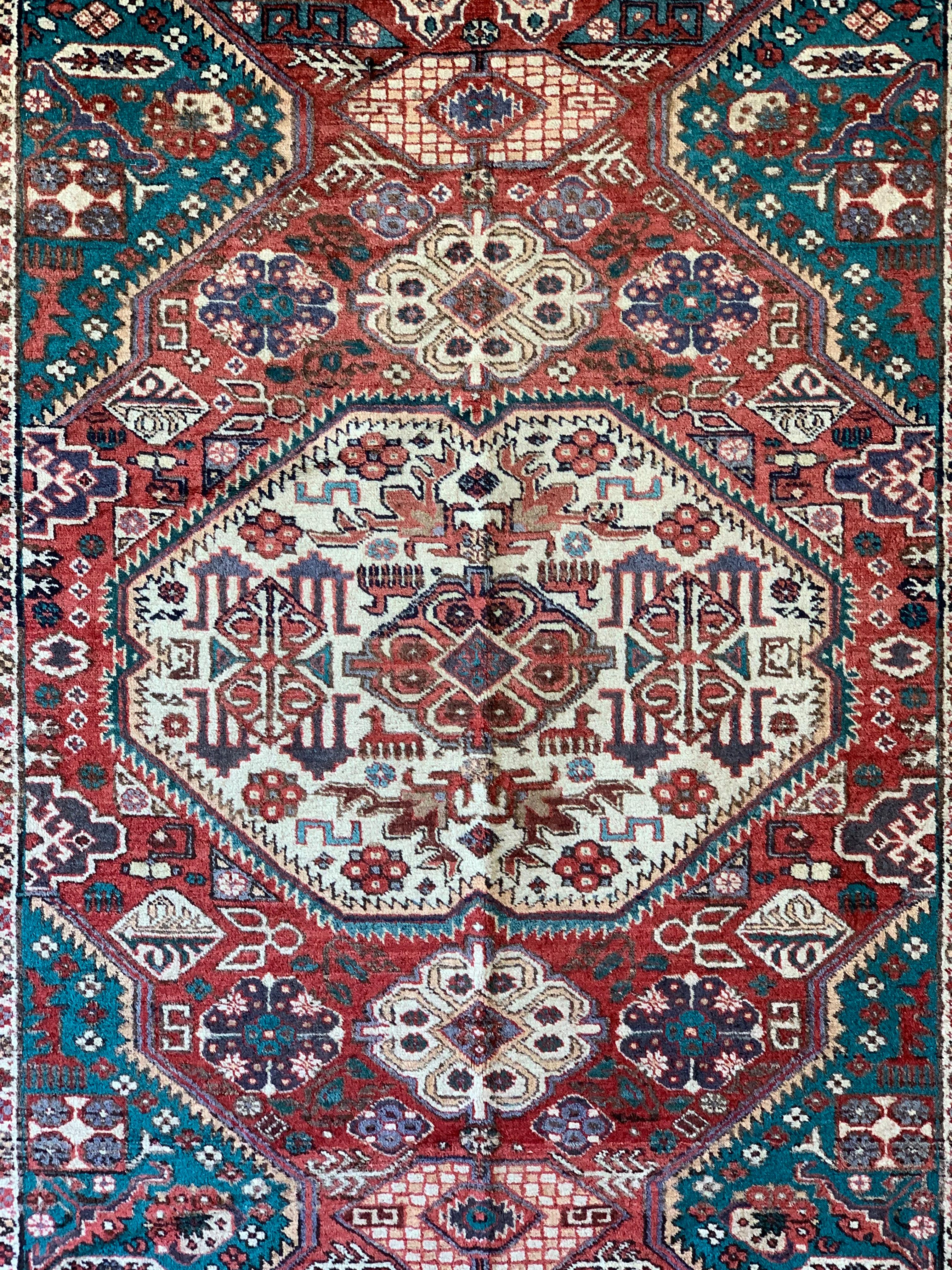 This is a vintage hand-knotted rug in the style of Chajli Kazak, made in Derbent, the southwestern edge of Russia near Azerbaijan, circa mid-1960s. It is wool knot on cotton warp and weft, and is approximately 5’4 x 9 ft. It is a beautiful rug in