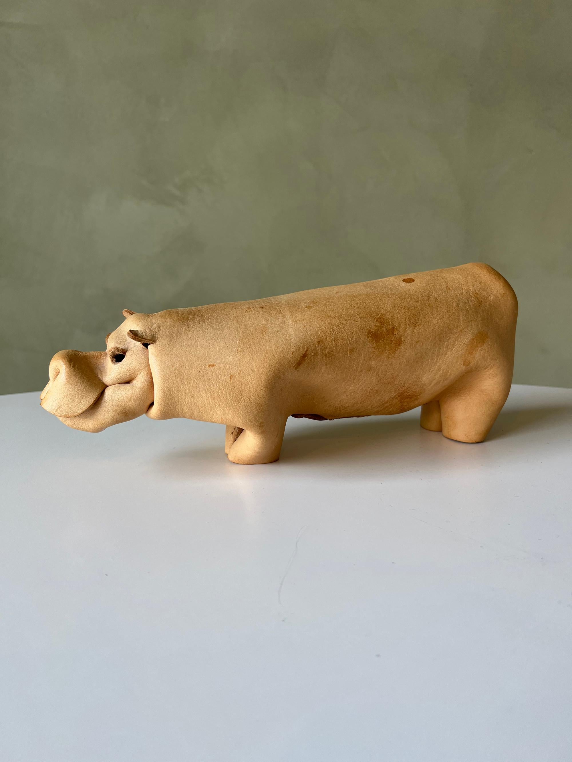 Vintage folded leather Hippo by Deru of Germany. Good condition overall, the leather is soft and supple and the rivet is intact. Some stains on the leather. Good example of a hard-to-find object.