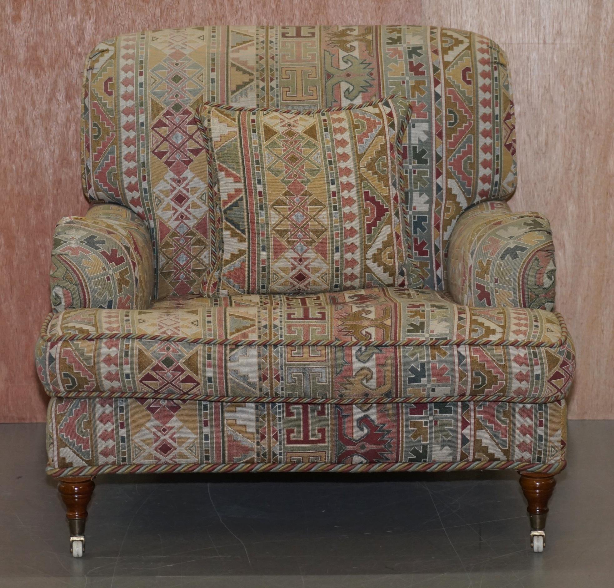 We are delighted to this lovely handmade in England Derwent Kilim pattern upholstery Howard armchair

I have the matching sofa listed under my other items

A very good looking decorative and well-made piece. The chair was made by Derwent and it
