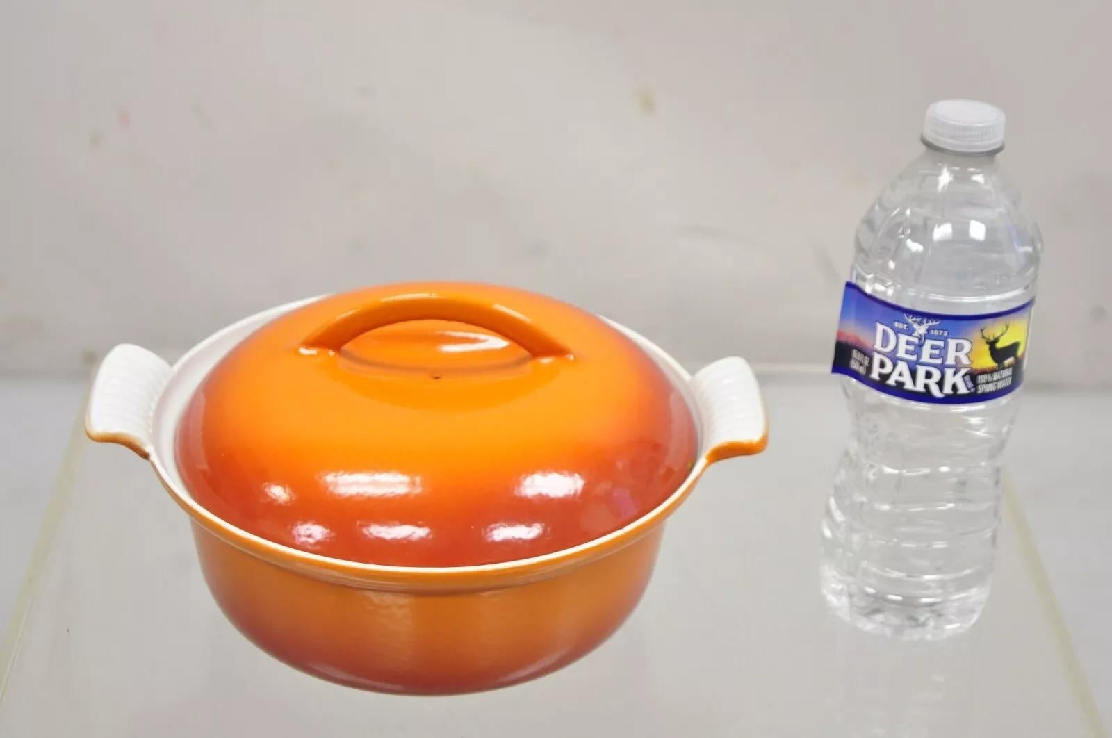 Vintage Descoware Mid Century Modern Cast Iron Orange Enamel Lidded Dutch Oven. Circa Late 20th Century. Measurements: 5