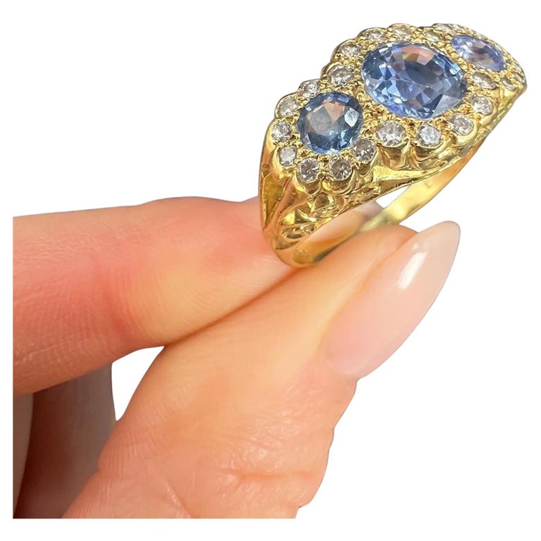 Bague marguerite vintage en or 18 carats, saphir bleu au fond et diamants