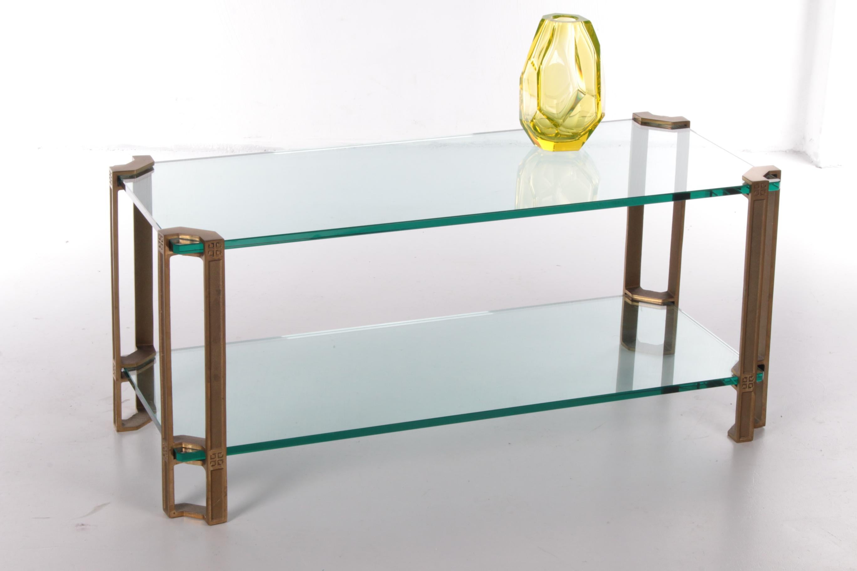 Top design table by Peter Ghyczy.

from the 1970s Model number T24

Is solid cast brass

The table consists of 2 glass plates of 16 mm thick.

The glass plates are in very good condition with hardly any scratches.

The pedestals can be