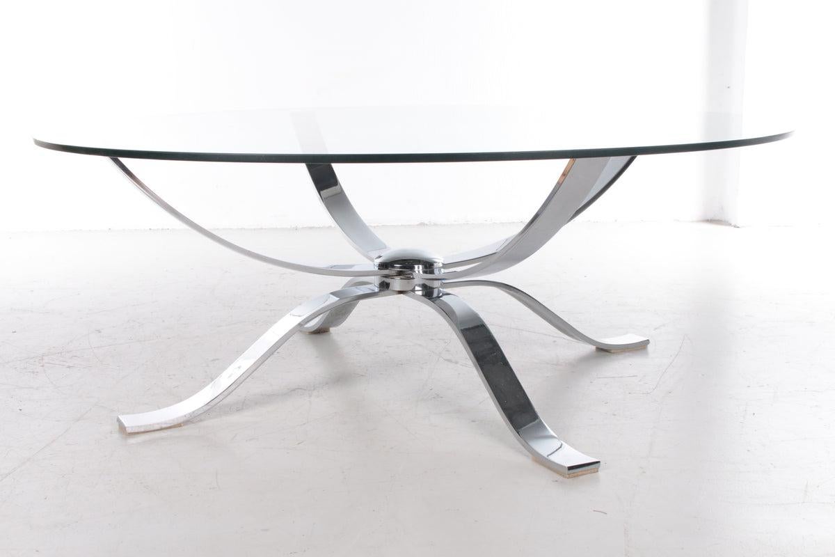 Vintage Design Coffee Table With Chrome Base Space Age, 1970s

Beautiful round Spage Age coffee table with a beautiful chrome base. 

The table was produced in Germany and is from the 1970s.

The round top is made of beautiful thick glass that can
