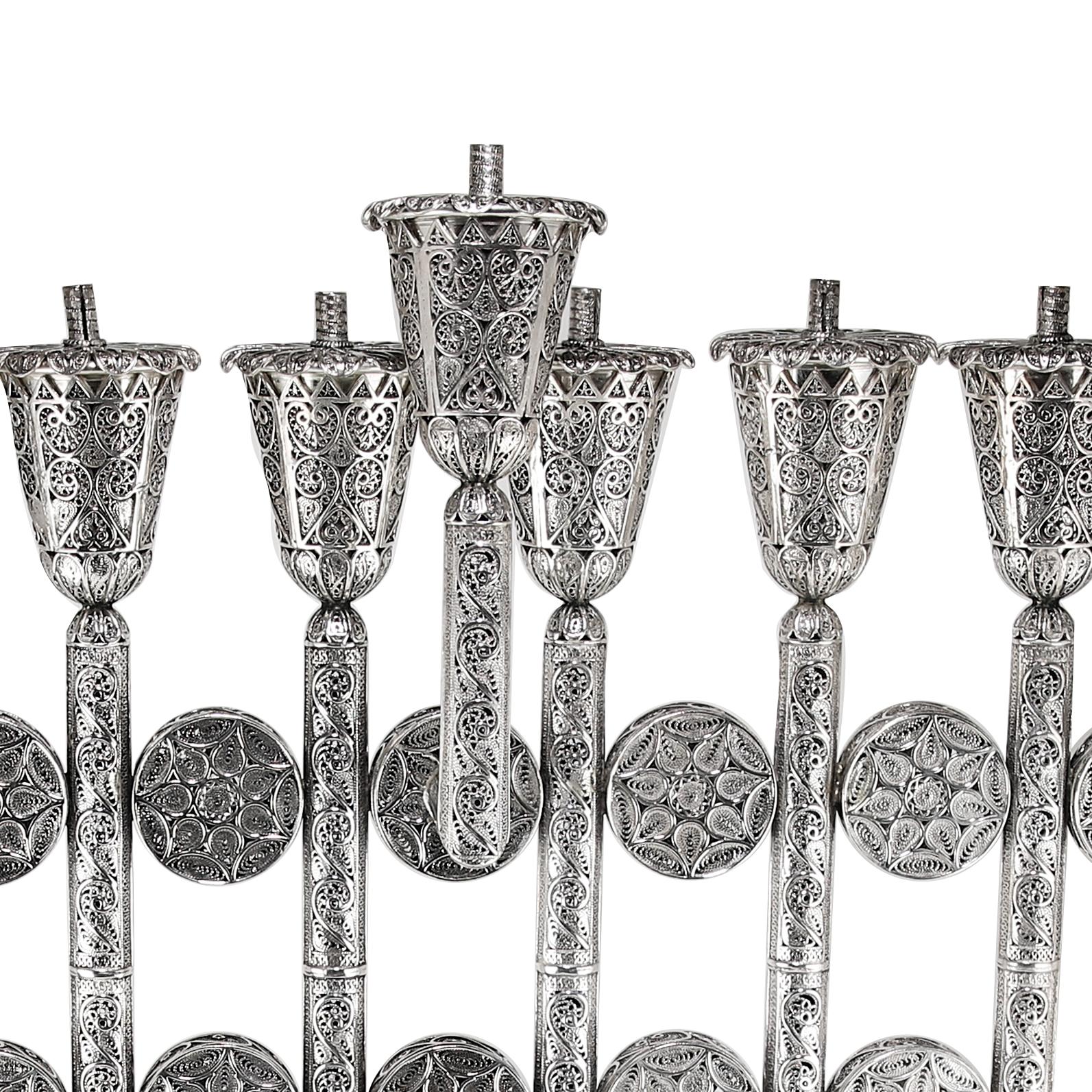 A beautiful piece to celebrate the important holiday of Hanukkah with. This menorah is all handmade from Sterling Silver stamped .925, in Israel by a yemenite artisans with filigree technique that was created 100’s of years ago, and still is being