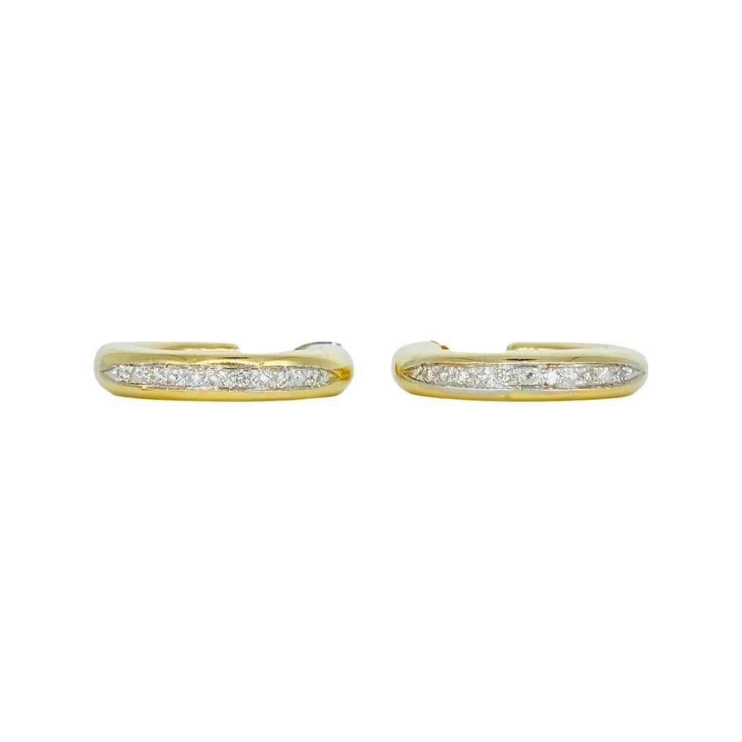 Vintage Designer 0.18 Total Carat Weight Diamonds Half Hoop Earrings. Beautiful earrings featuring 12 round diamonds totaling a weight of 0.18 carat. The earrings measure width 4.5mm by Height 25mm and is made in 14k gold. The earrings feature a