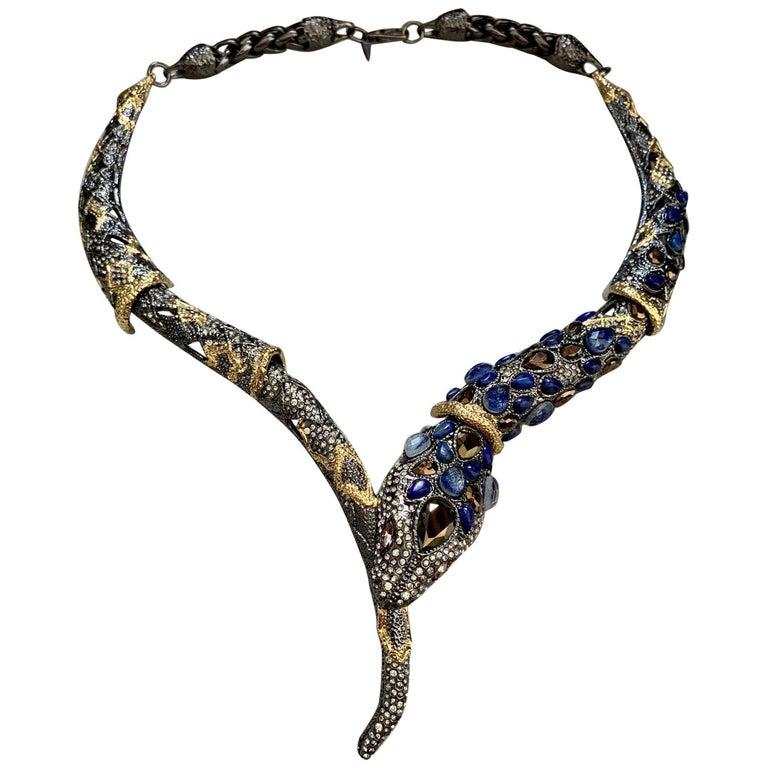 Simply Fabulous! Exotic Jardin de Papillon Snake Serpent Necklace by Alexis Bittar.  Encrusted with sparkling Teardrop Blue, Brown and round Crystals inter-spaced with gold gilt accents. Approx. 18