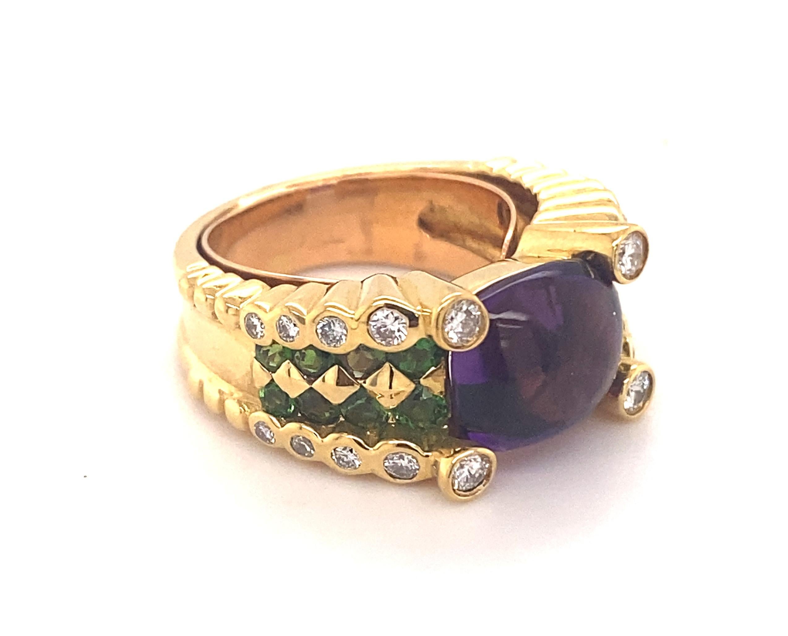 Vintage Designer Amethyst Tsavorite Diamond 18K Yellow Gold Ring. This is a beautiful designer ring with the highest quality stones you can hope to find. It is set with a natural cabochon amethyst with gorgeous color and clarity. On either side of