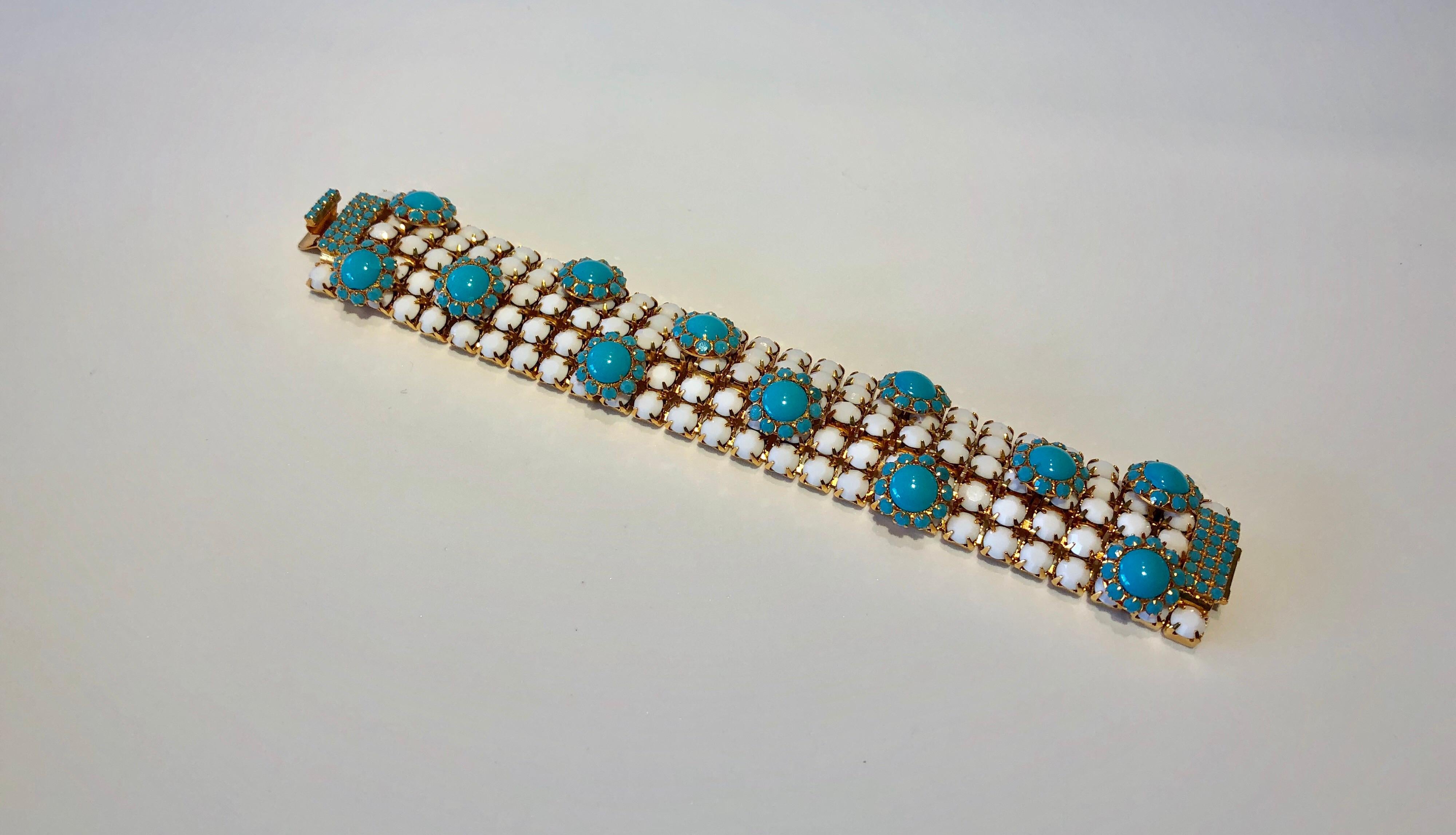  Stylish vintage designer faux turquoise statement bracelet by William de Lillo c.1970 - the unique architectural bracelet is comprised of gilt metal and features five rows of faceted white glass rhinestones. Accenting the bracelet are starburst