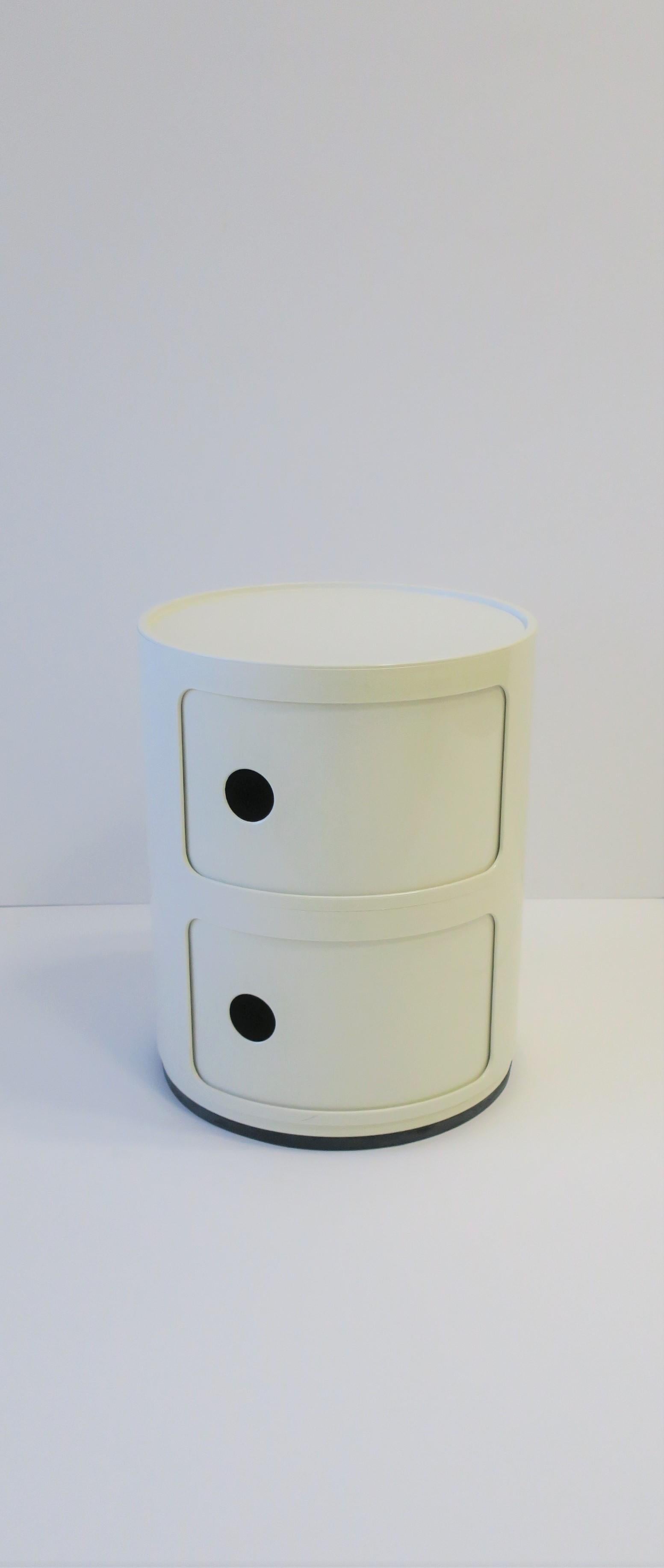 A vintage designer Italian Postmodern white Kartell 2-tier storage cabinet piece designed in the late 20th century by Anna Castelli for Kartell. Made in Italy. This iconic vintage storage piece, aka the Componibili, has two storage areas with