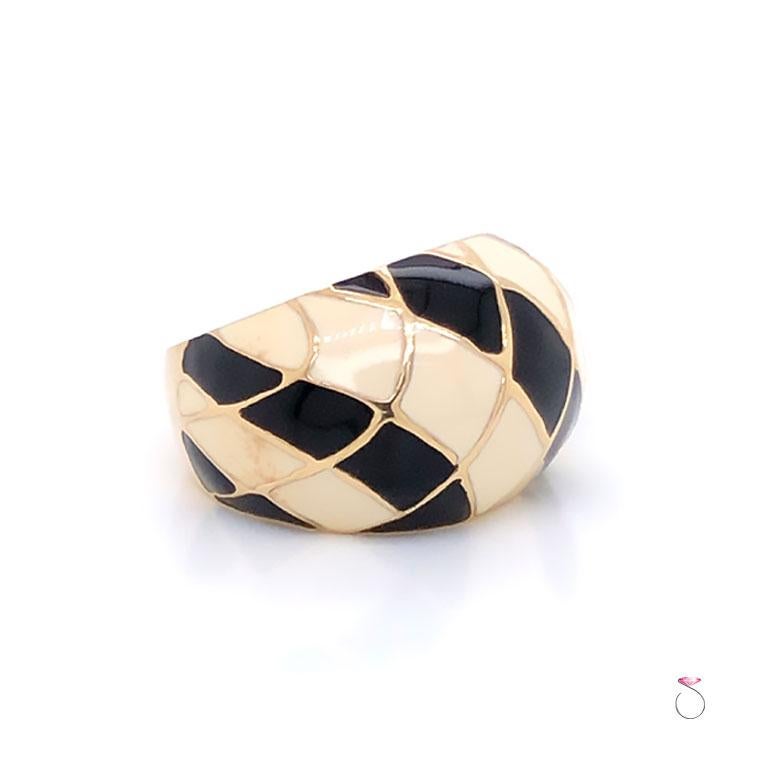 Stunning vintage enamel large dome ring by MAZ. The ring is beautifully crafted in 14K yellow gold and features black and white diamond shapes enameled in a checkers design. This dome ring measures 14.9mm wide. The ring is stamped 