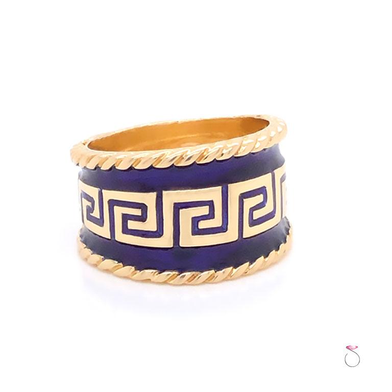Stunning vintage enamel wide cigar ring by MAZ. The ring is beautifully crafted in 14K yellow gold and feature bluie enamel with Greek key design. The enamel on the ring is in excellent condition with no damage. This wide cigar ring measures 15mm