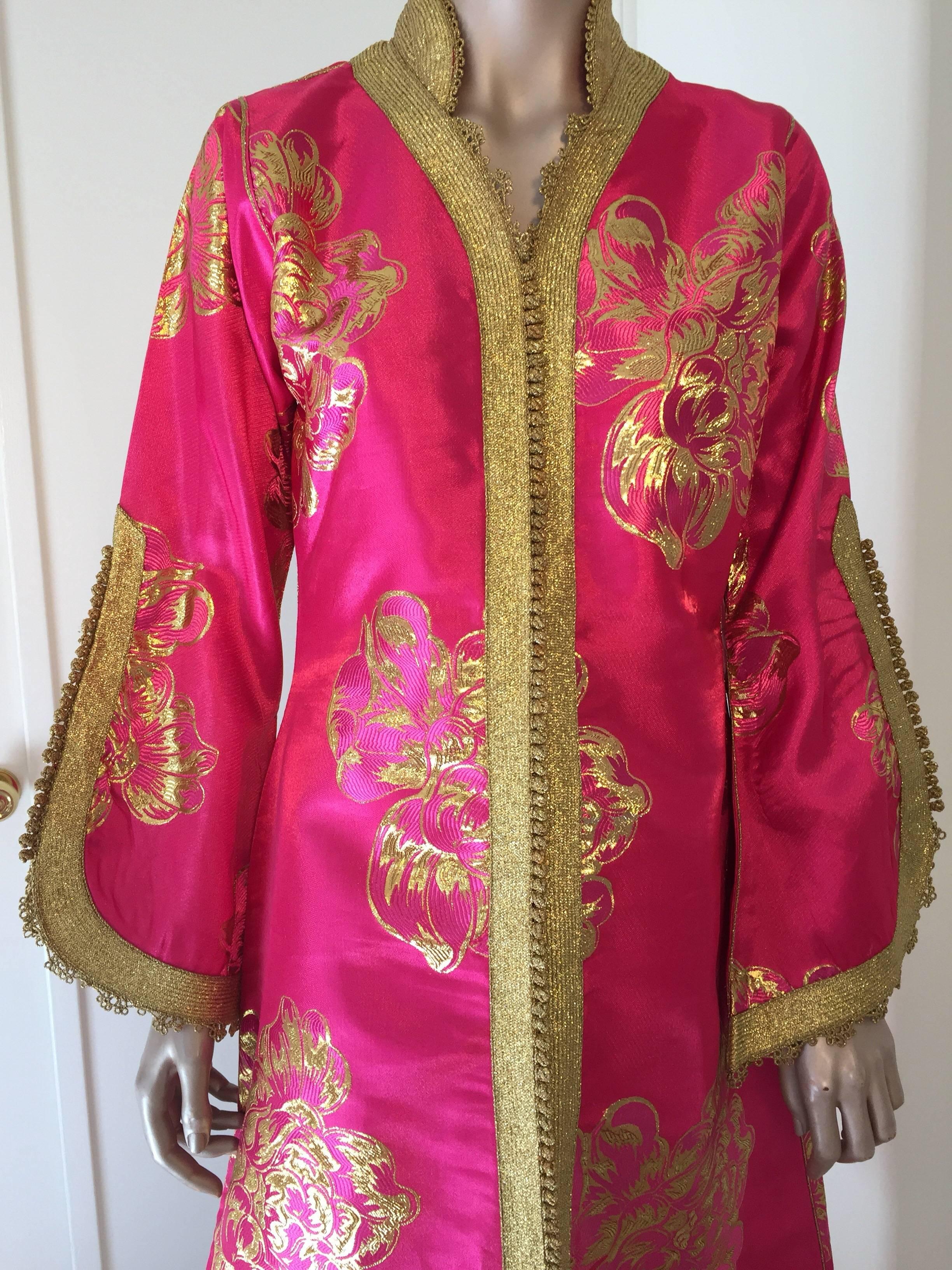 Elegant vintage brocade designer Moroccan kaftan, embroidered with pink and gold trim.
This chic Gypsy Bohemian maxi dress brocade kaftan is embroidered and embellished with gold thread metallic trim. 
One of a kind evening Moroccan Middle Eastern