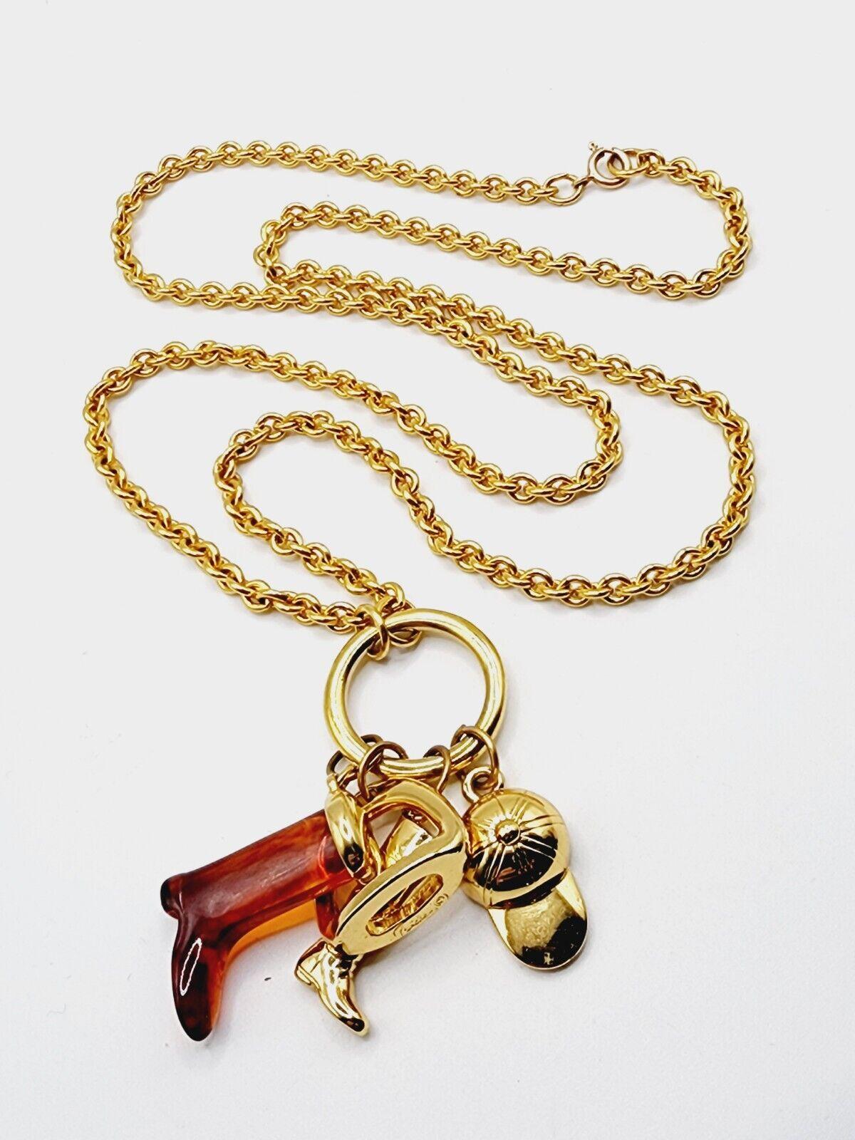 Simply Beautiful! Vintage Mid Century Modern Rare Equestrian themed Multi Charm Designer Necklace Signed CAROLEE. Featuring 4 Equestrian themed Pendant Charms, approx. 2 25” long. Suspended from a 30” long Gold-plated chain. Circa 1980s. More