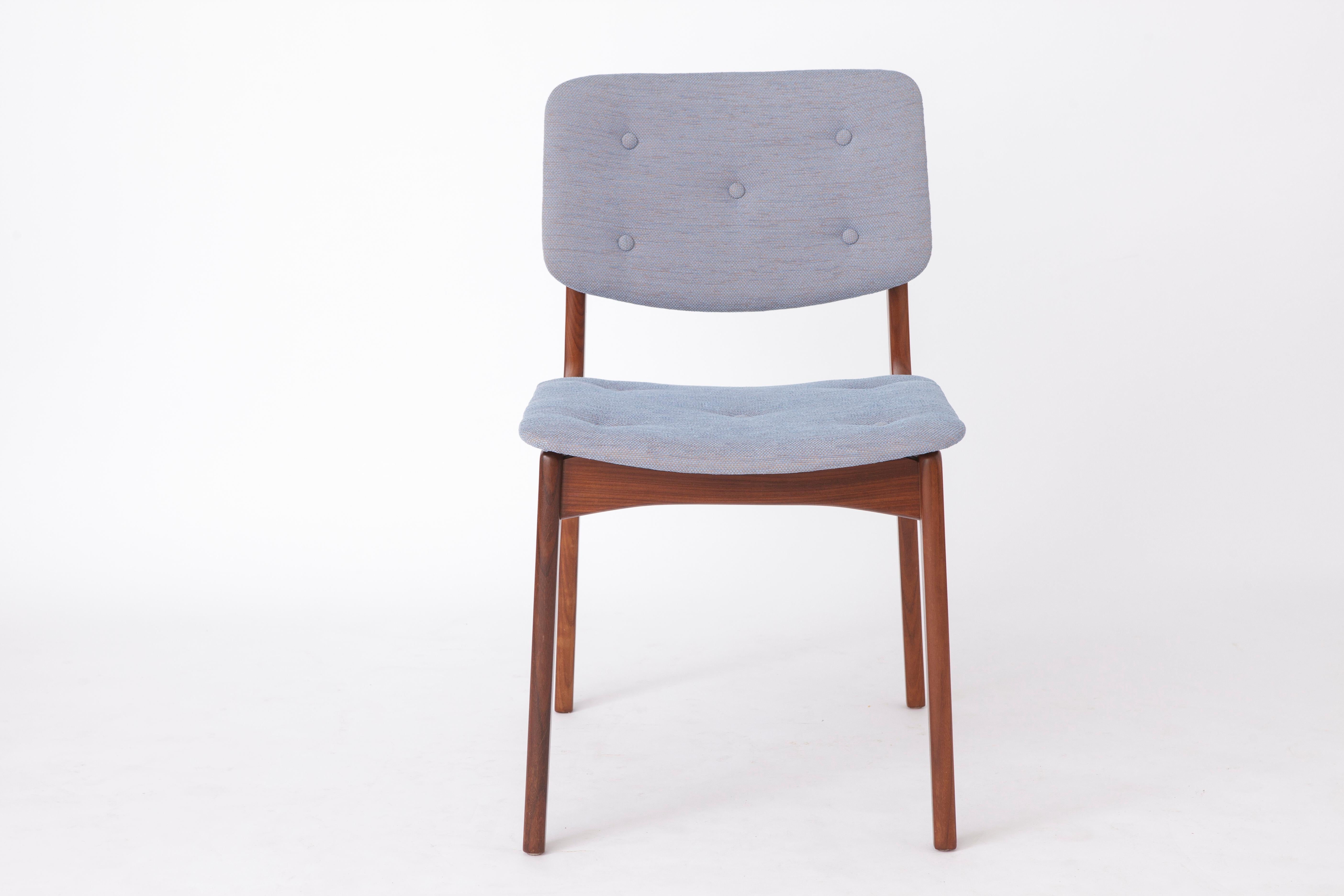 Single mid-century desk chair. 
Production period: 1970s. 
Unknown designer. 

Very good condition. Stable teak chair frame.
Newly reupholstered with blue textile cover. 

