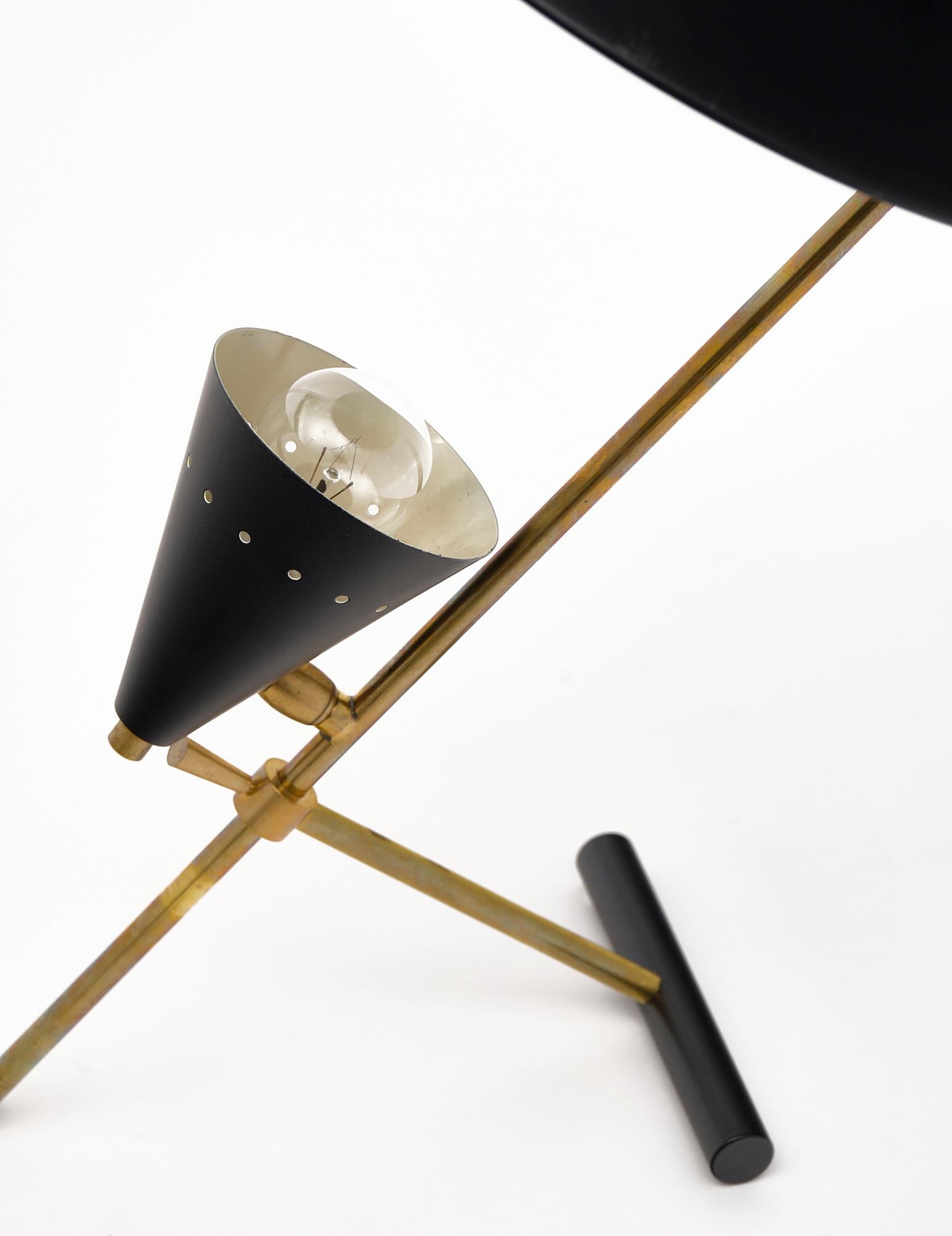 Vintage desk lamp attributed to Stilnovo made of “tole” and gilt brass. We love the iconic details of this Italian fixture. It has been newly wired to fit US standards.