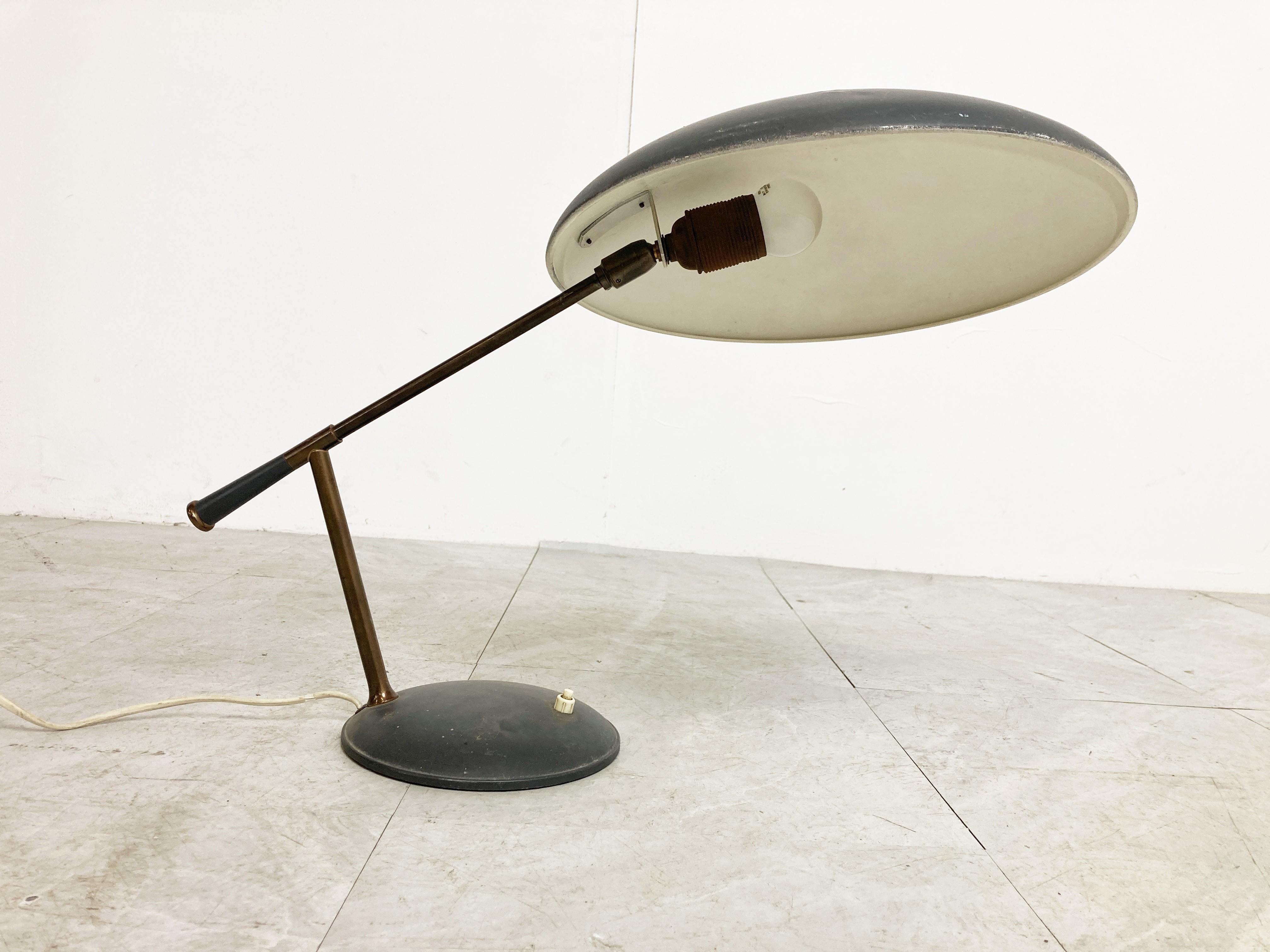 Rare desk lamp by Louis Kalff for Philips.

This midcentury table lamp has a beautiful design and is rather unique.

Louis Kalff made some famous designs like the Timor desk lamp or the 'z' shaped desk lamp.

The angle of the shade is