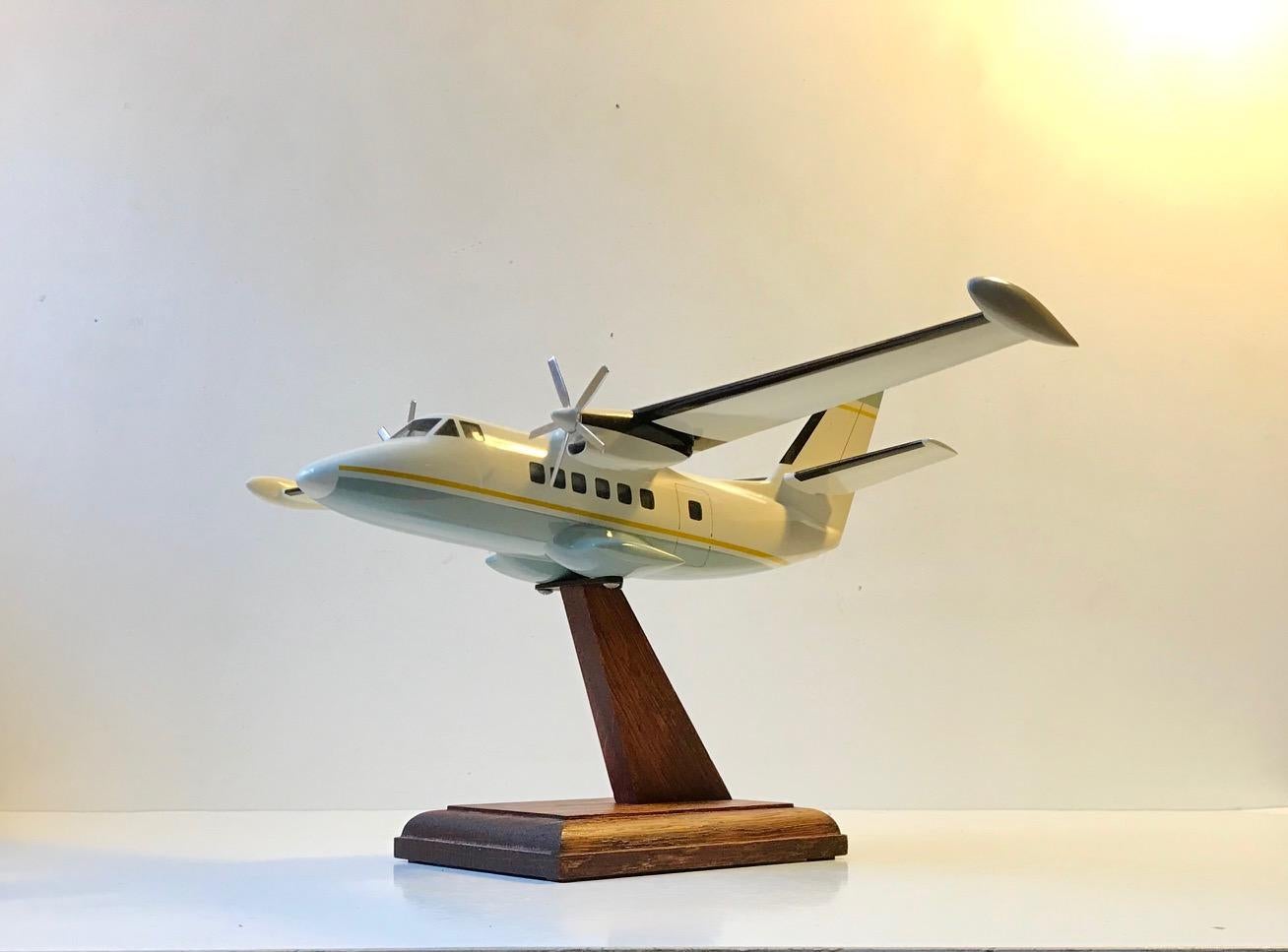 A well-made mounted desk model of an aero plane/private jet. Professionally mounted on an oak stand. Unknown Scandinavian maker, circa 1970-1975. It’s made from lacquered acrylic, tinplate and oak (stand).
