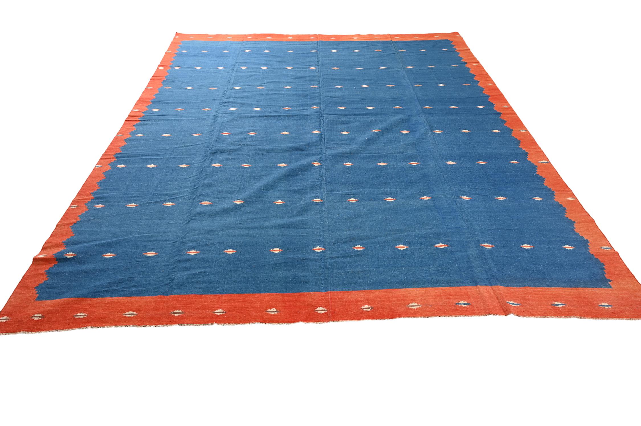 This vintage 9x11 Dhurrie is an exciting new entry in Rug & Kilim's esteemed flat weave collection. Handwoven in cotton, it originates from India circa 1950-1960. 

Further on the Design:

This flat weave carries rich blue on the field with a