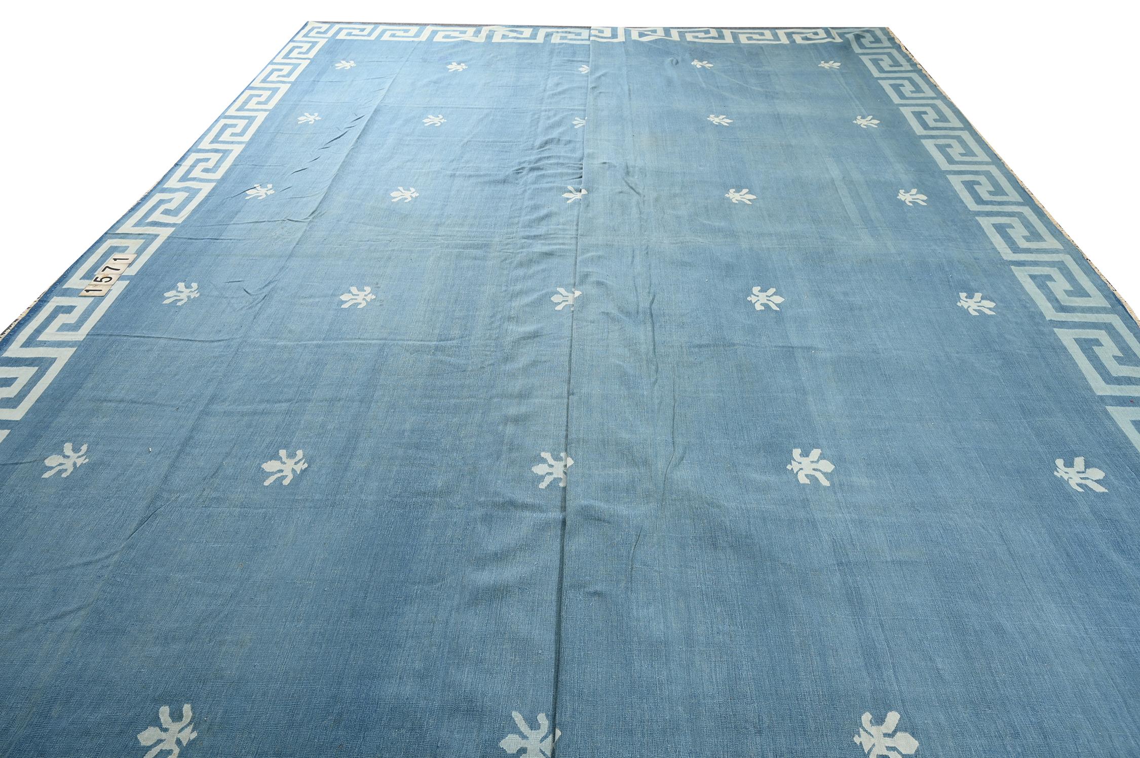 This vintage 17x21 Dhurrie is an exciting new entry in Rug & Kilim's esteemed flat weave collection. Handwoven in cotton, it originates from India circa 1950-1960. 

Further on the Design:

This flat weave unfurls in tones of blue with