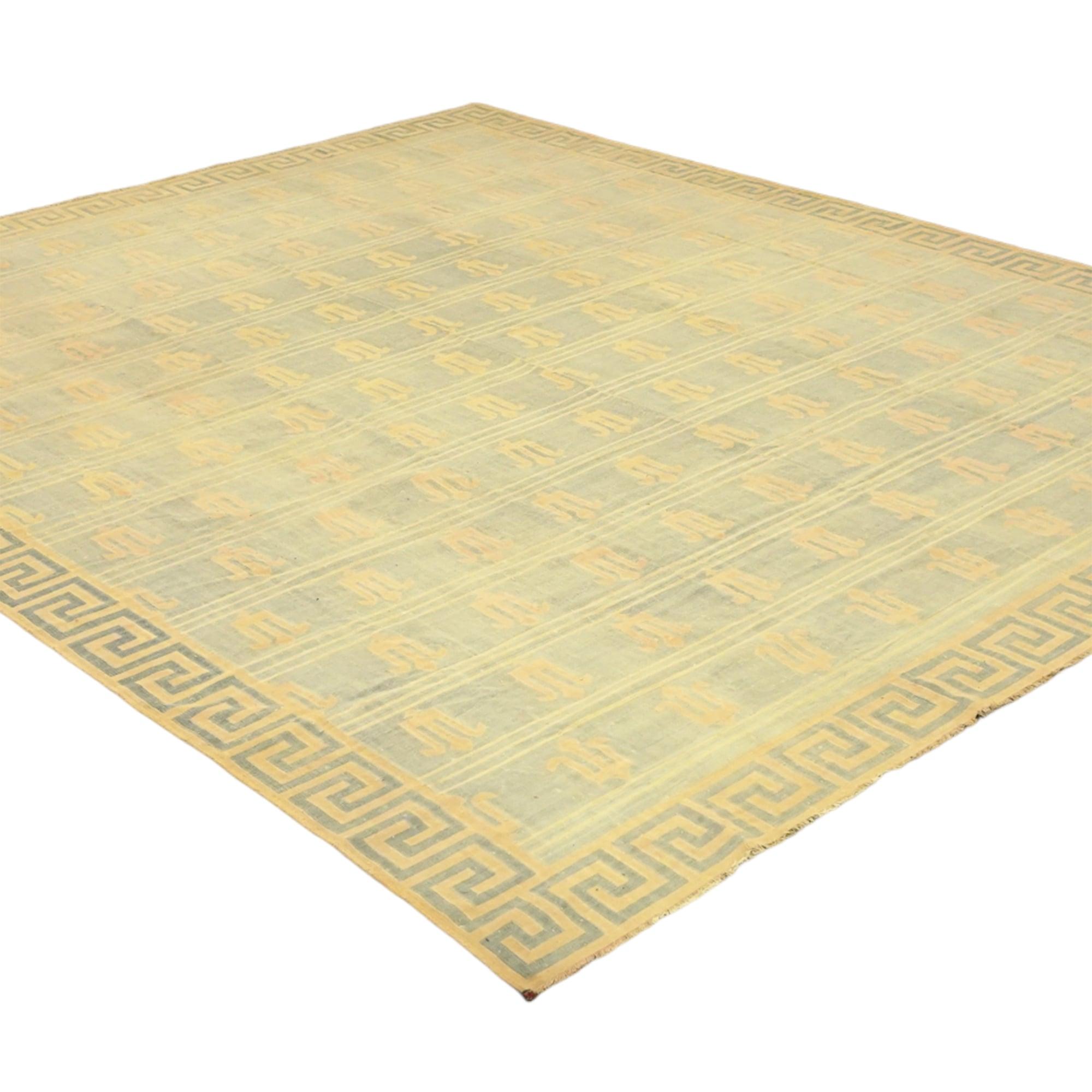 This vintage 13x14 Dhurrie flat weave is an exciting new entry in our esteemed collection. Handwoven in wool, it originates from India circa 1950-1960. 

On the Design: 

From our exclusive collection of vintage flatweaves, a masterpiece