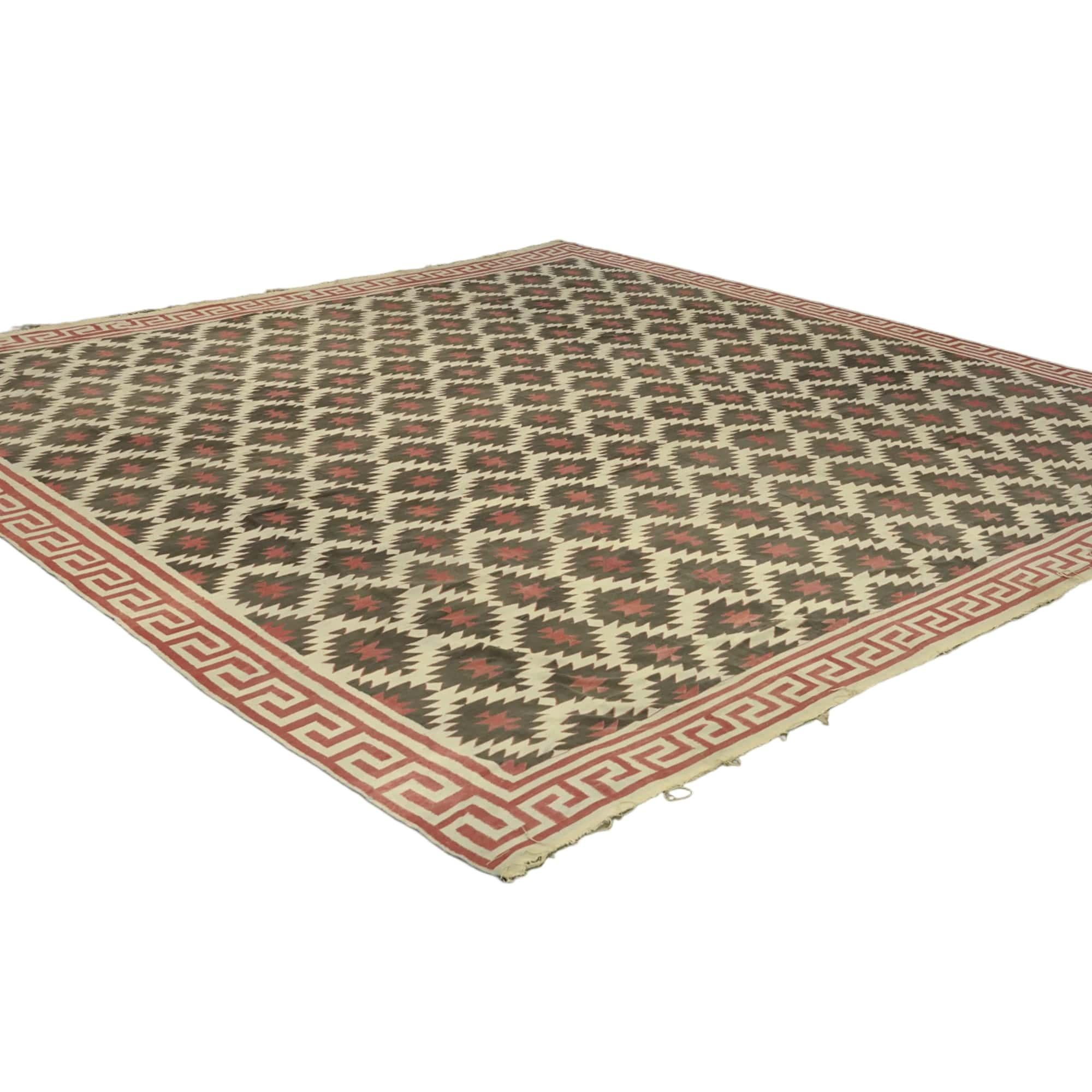 This vintage 16x16 Dhurrie flat weave runner is an exciting new entry in our esteemed collection. Handwoven in wool, it originates from India circa 1950-1960. 

On the Design: 

From our exclusive collection of vintage flatweaves, a masterpiece