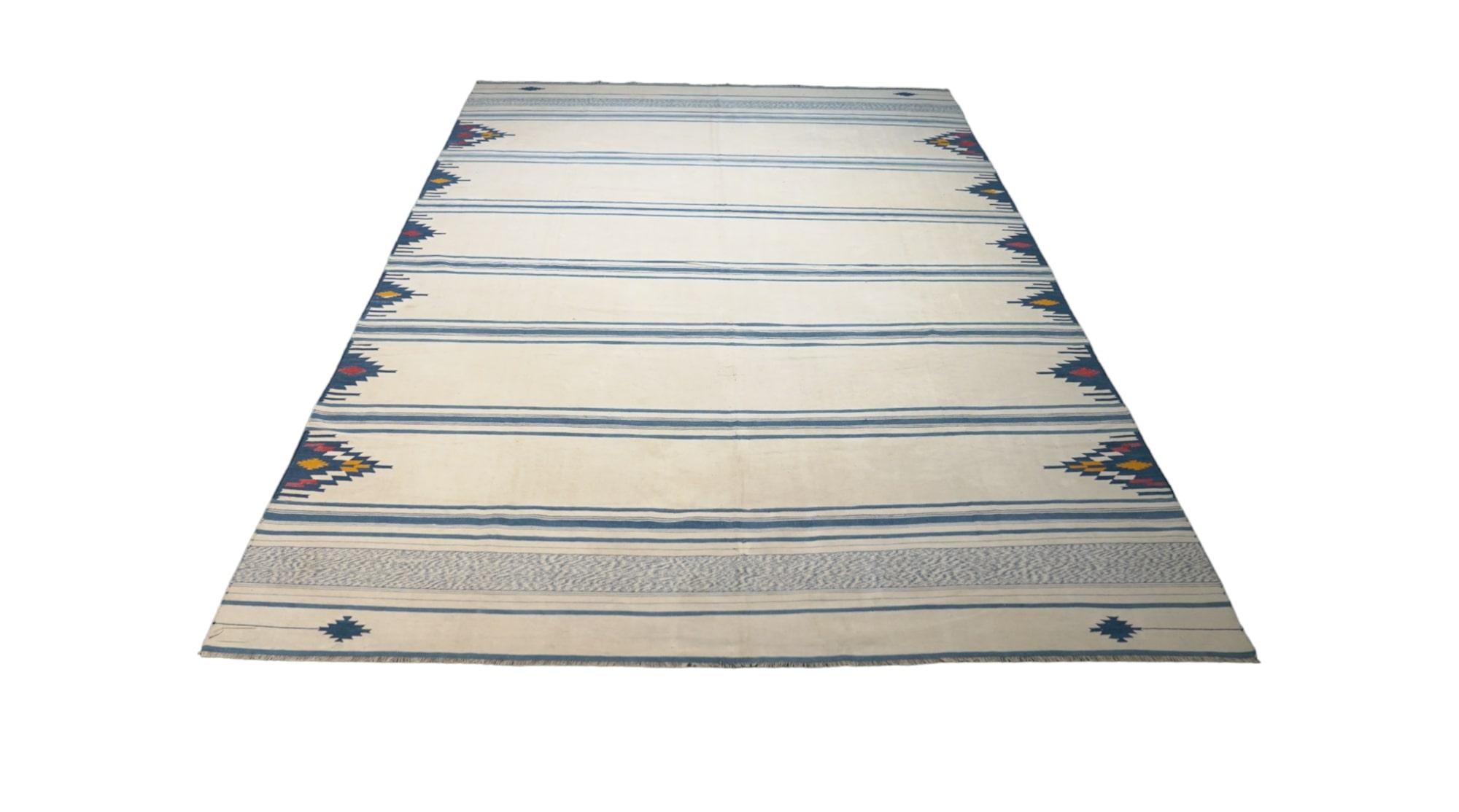 This vintage 6x9 Dhurrie flat weave is an exciting new entry in Rug & Kilim’s esteemed collection. Handwoven in wool, it originates from India circa 1950-1960. 

On the Design: 

From Rug & Kilim’s exclusive collection of vintage flatweaves, a