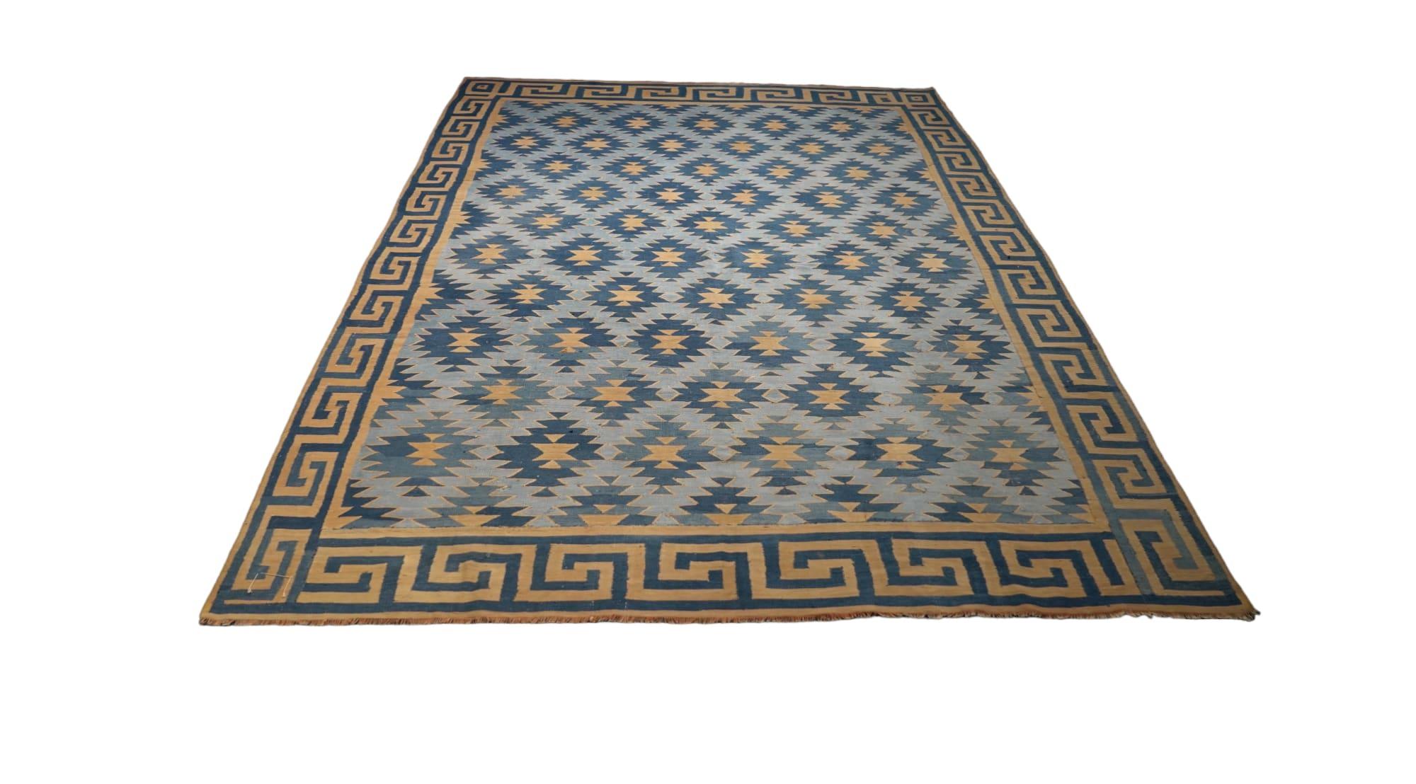 This vintage 7x9 Dhurrie flat weave is an exciting new entry in Rug & Kilim’s esteemed collection. Handwoven in wool, it originates from India circa 1950-1960. 

On the Design: 

From Rug & Kilim’s exclusive collection of vintage flatweaves, a