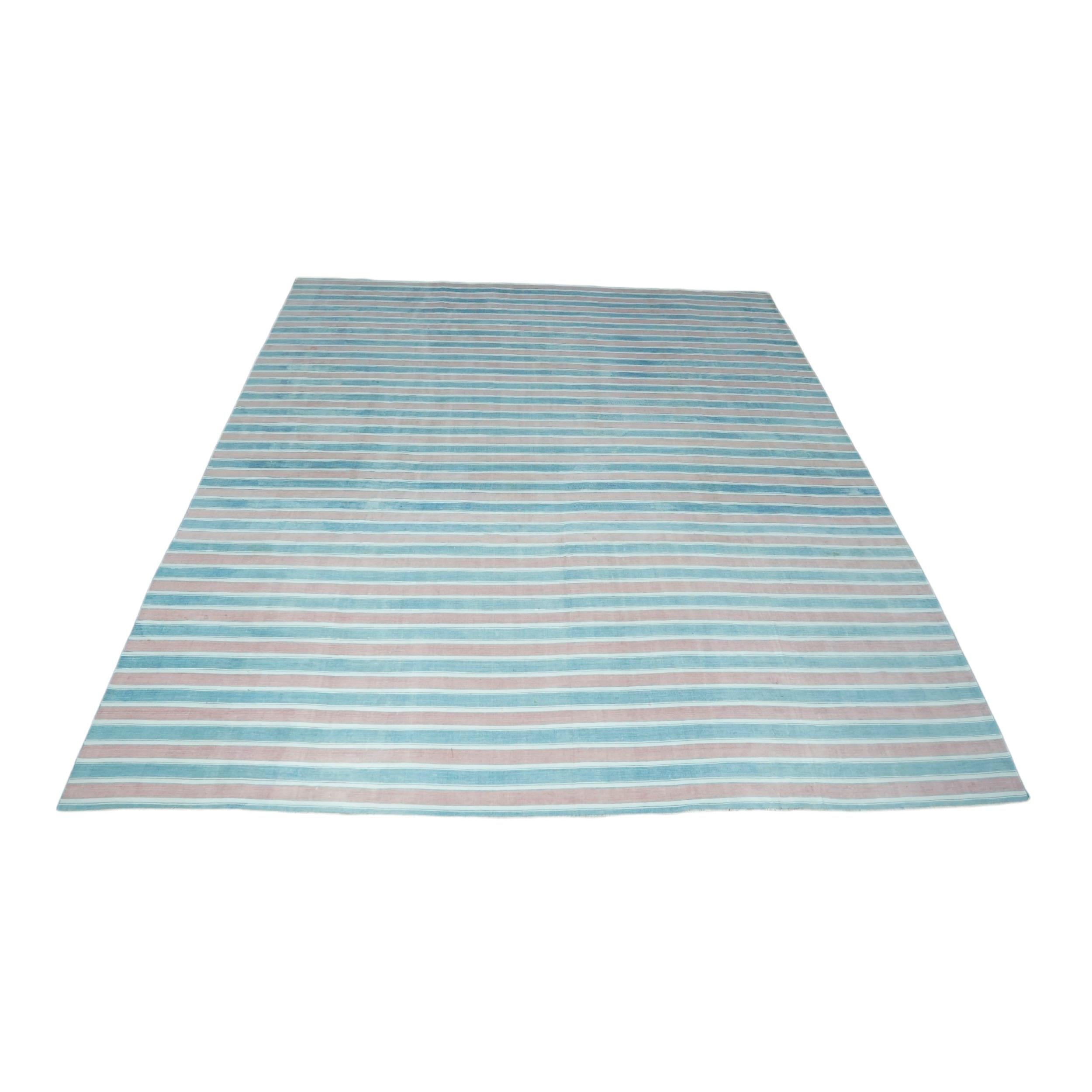 This 9x12 vintage Dhurrie rug is an exciting new curation from Rug & Kilim’s latest acquisition of rare and exemplary mid-century flatweaves of the same style—handwoven in cotton in India circa 1950-1960. 

On the Design: 

Admirers of the craft