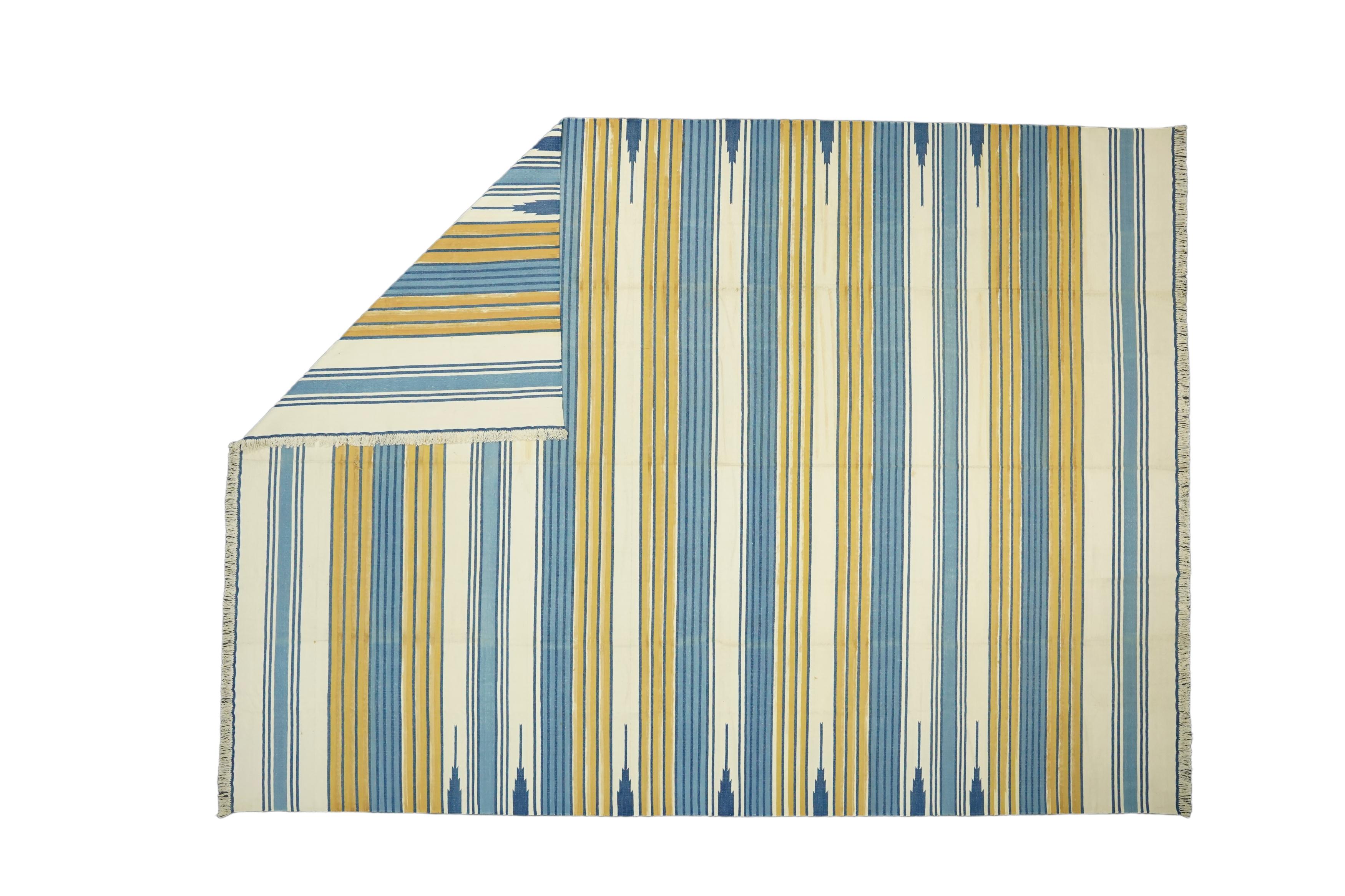 This 10x14 rug is a rare vintage Dhurrie rug from an exciting new mid-century curation by Rug & Kilim. Handwoven in a wool flatweave, it originates from India circa 1950-1960, and enjoys blue, cream and gold stripes. 

On the Design: 

Admirers of