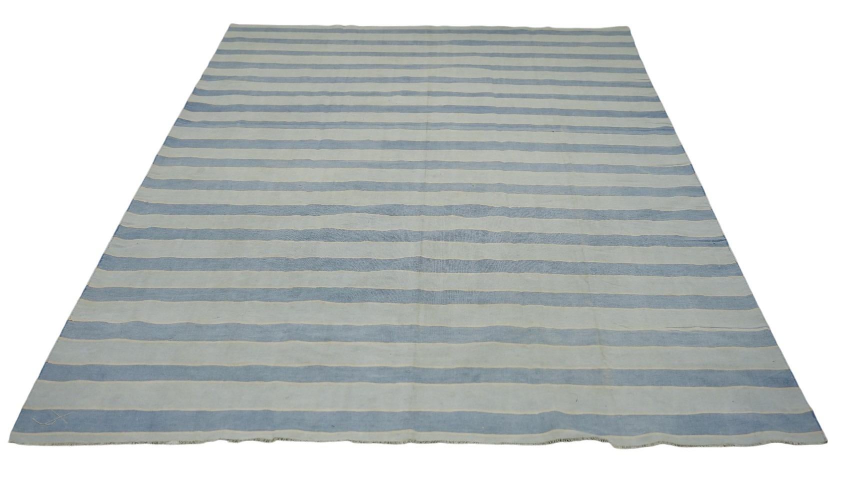This 6x9 vintage Dhurrie rug is an exciting new curation from Rug & Kilim’s latest acquisition of rare and exemplary mid-century flatweaves of the same style—handwoven in cotton in India circa 1950-1960. 

On the Design: 

Admirers of the craft will