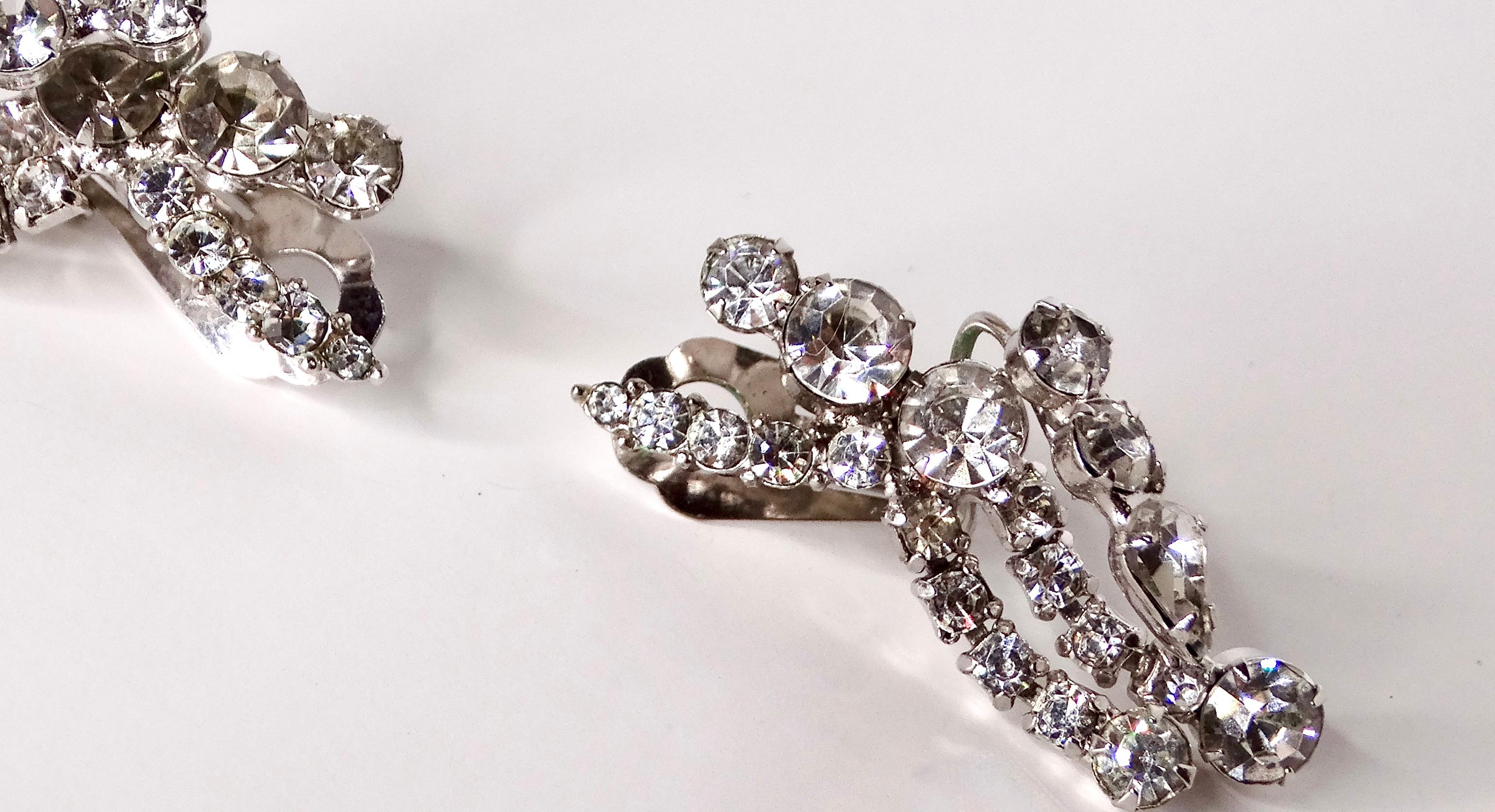 Elevate your jewelry collection with these exquisite Vintage Diamante Crystal & Sterling Silver Plated Dangle Earrings. Featuring sparkling diamante crystals that catch the light beautifully, these earrings exude timeless elegance and