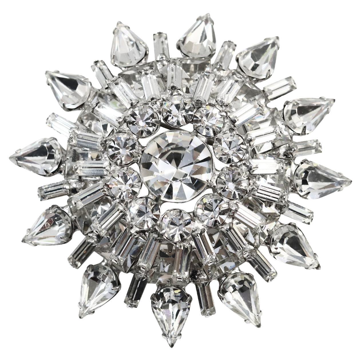 Vintage Diamante Double Layer Round Brooch Circa 1960s. The brooch is made of  pears, baguettes, and round diamante shapes all prong set. The end row is pear shapes that face outward in a spiky pattern.  So chic for the 1960s and so relevant for