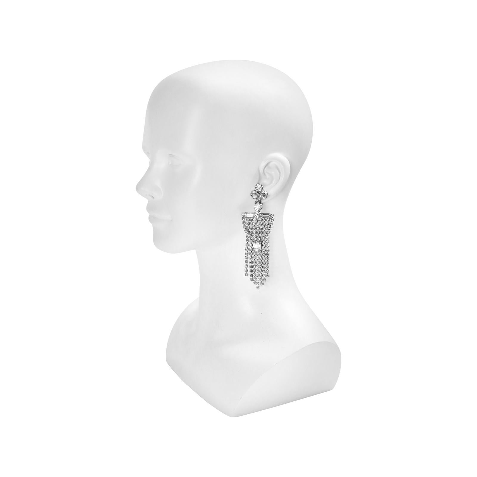 Vintage Diamante Fringe Waterfall Earrings. These dangle from three round stones and have a piece of draped fringe with an emerald shaped stone in the middle. Looks great with a t shirt or for a night out. Clip On.

These really are gorgeous!