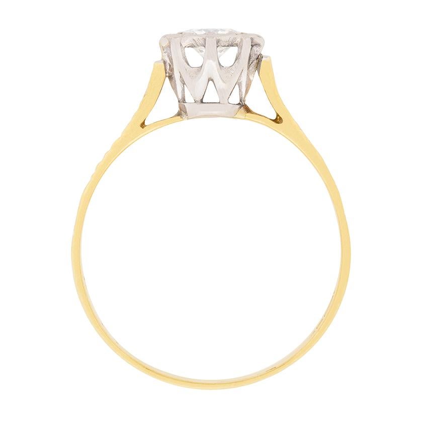 A vintage engagement ring boasting a 0.30 carat diamond. H colour and VS clarity, this stone is then beautifully highlighted with bark finish shoulders made of 18 carat yellow gold. The craftsmanship is clear, and the rub over setting for the