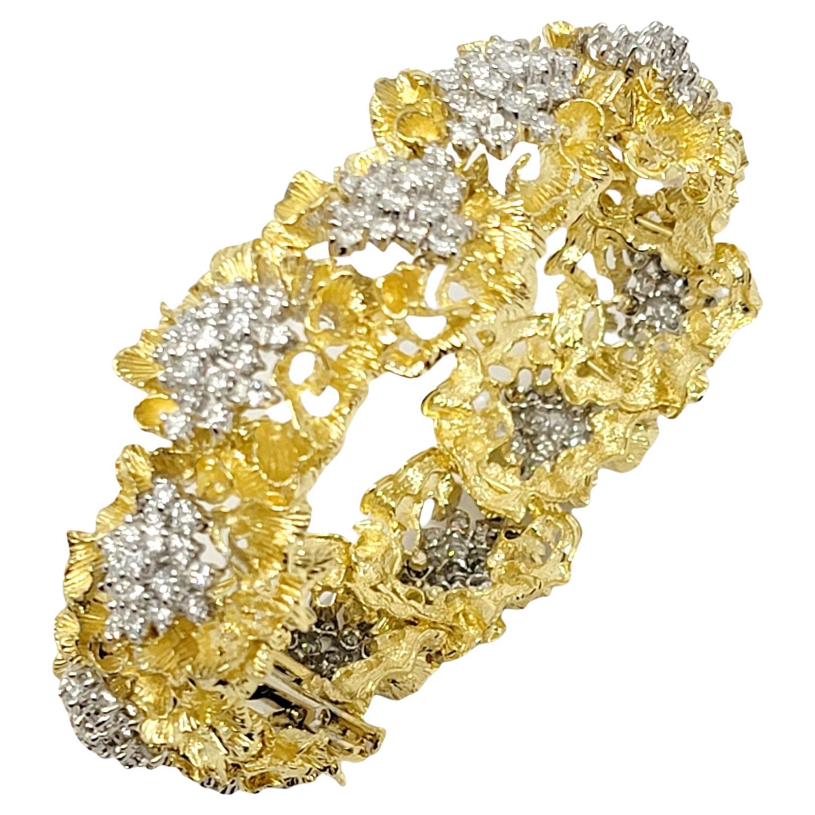 This gorgeous bracelet is made of solid 18 karat yellow gold.  It is a large, semi-rigid, open work, floral cluster motif bracelet prong set with 222 transparent, top white, round, brilliant cut, Natural Diamonds .

The gold work is unique, with a