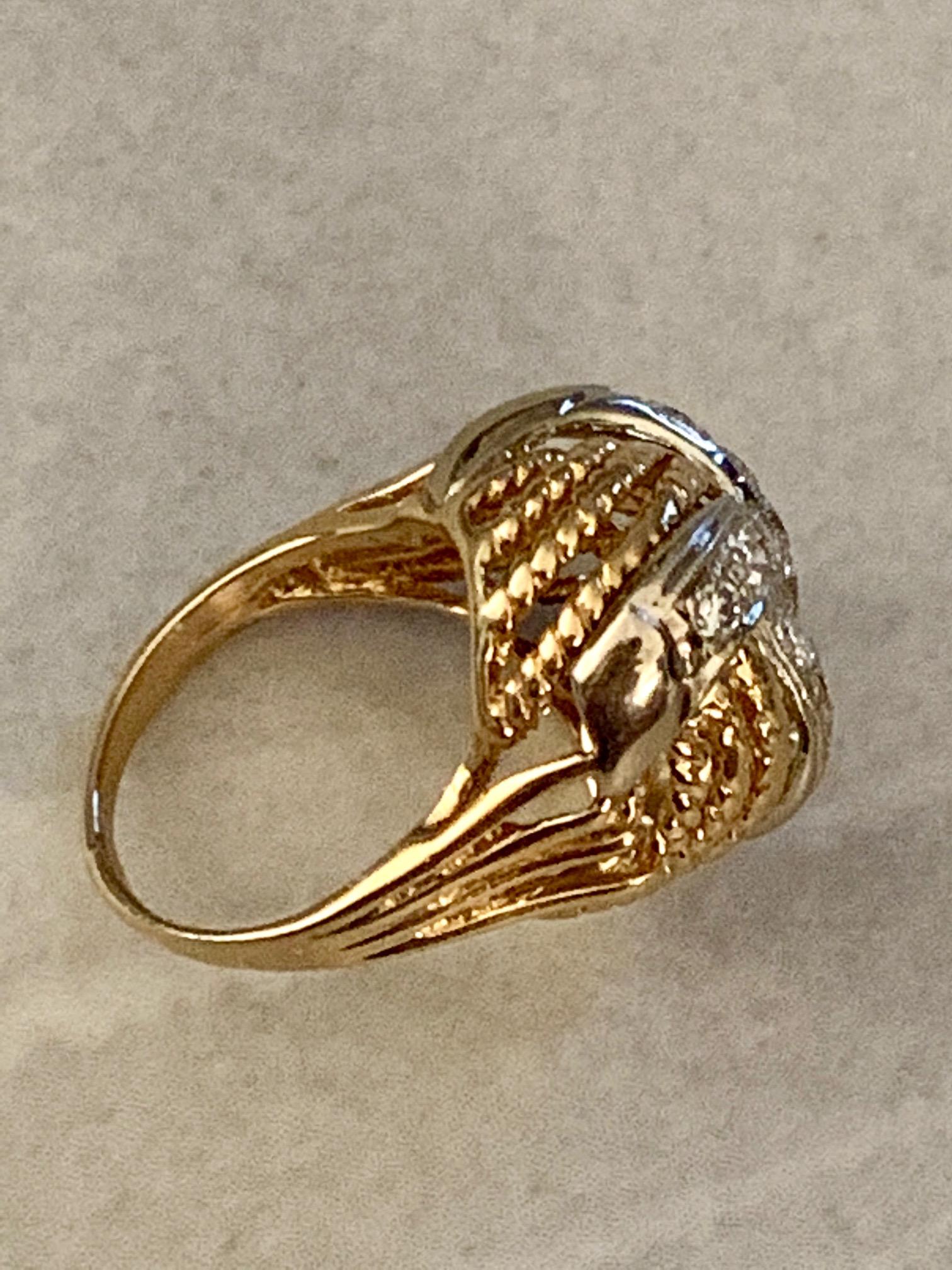 Now this is a dome ring!!  It features 13 brilliant cut Diamonds, totaling approximately 1.0ctw with average grades of VS-SI(I)-H.

The ring is 14 karat yellow Gold; the Diamonds are set in 14 karat white Gold.  

Size: 5 - This ring can be resized,