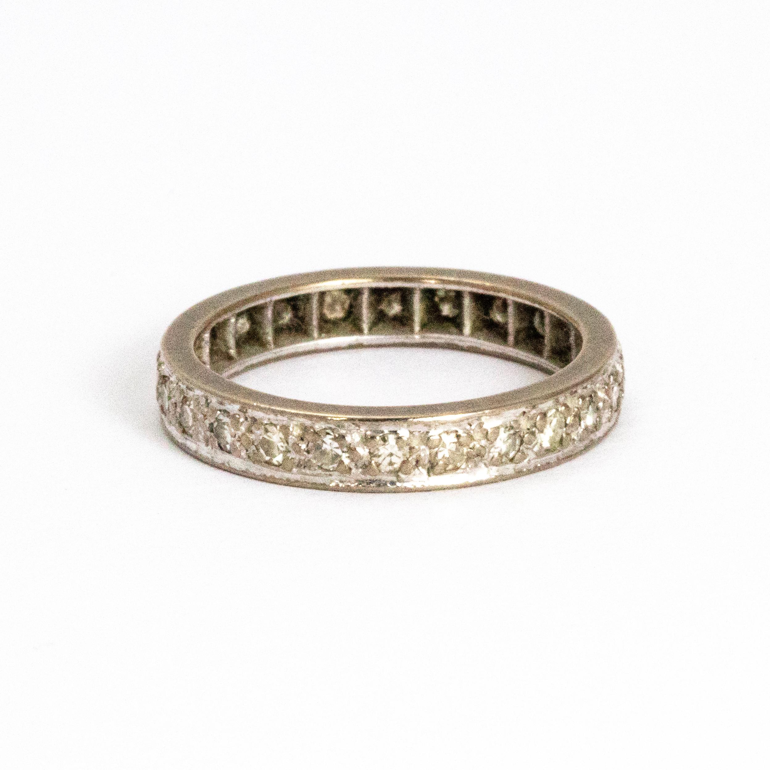 Sparkling full diamond eternity ring modelled out of 18ct white gold and made in London England in the 1970s.

Ring Size: M or 6
Band Width: 3mm