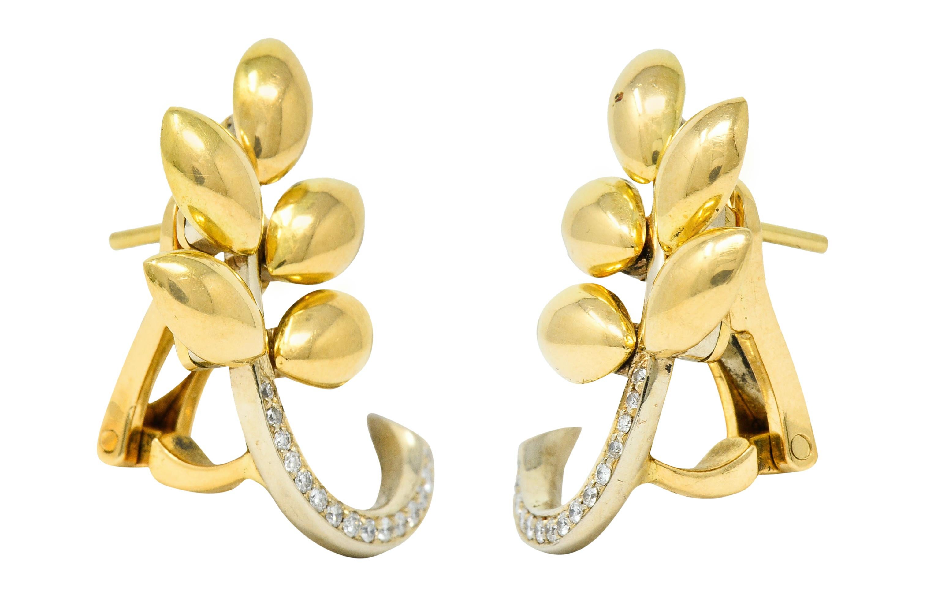Each earring is designed as a strand of high polished wheat

With slightly articulated yellow gold grains and a torqued white gold stem

Stem is bead set throughout by round brilliant cut diamonds, graduating in size

Weighing in total approximately