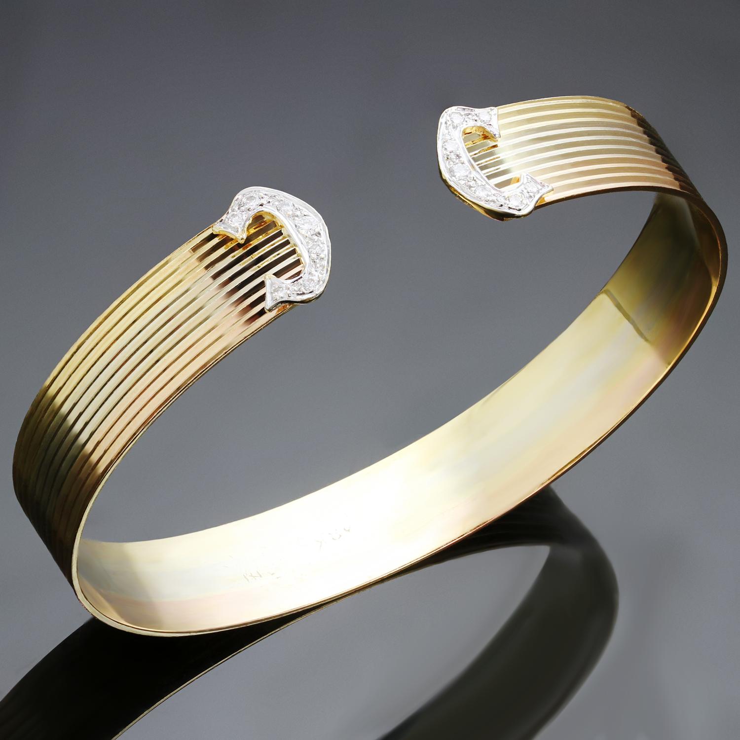 Vintage cuff bangle is crafted in 18k yellow, white, and rose gold. Made in Italy circa 1980s. Measurements: 0.43