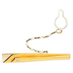 Fermacravatte vintage con diamante 18k bicolore