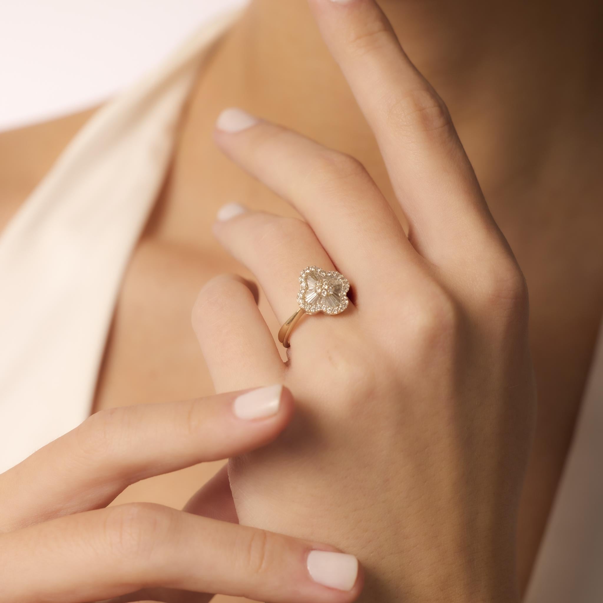 This vintage 1990s ring features 55 round and baguette cut diamonds totaling 0.85 carats, set in polished 18k yellow gold with classic styling and hallmarks.